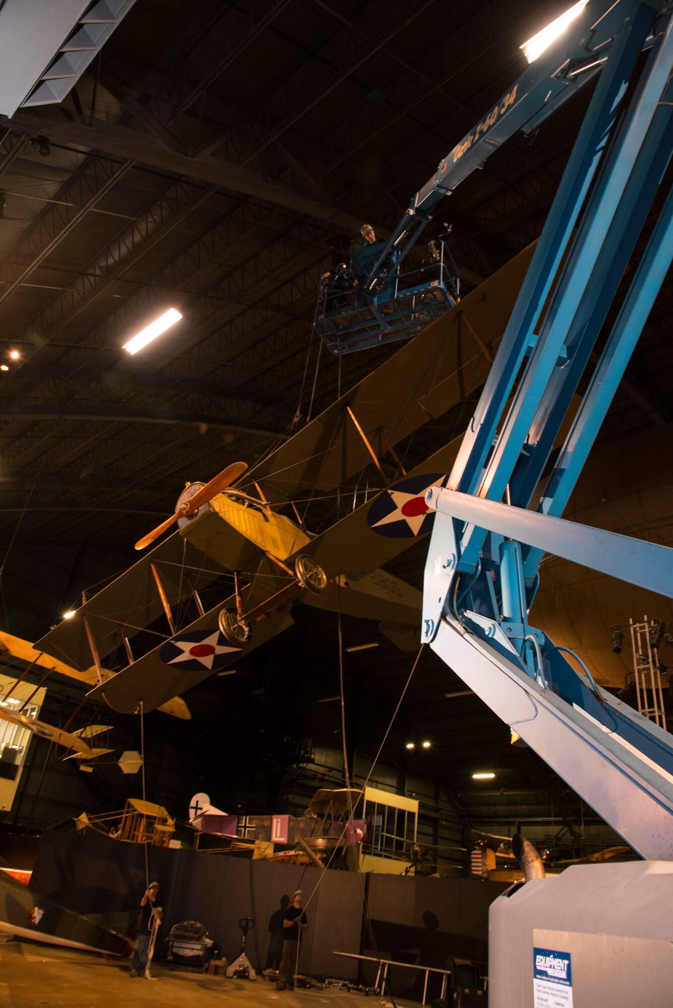 DAYTON, Ohio -- National Museum of the U.S. Air Force restoration crews lowered the Curtiss JN-4D Jenny from its hanging position on Nov. 7 2018 in the Early Years Gallery. Plans call for the Avro 504K to hang above the JN-4D after the restoration process is completed. (U.S. Air Force photo by Ken LaRock)