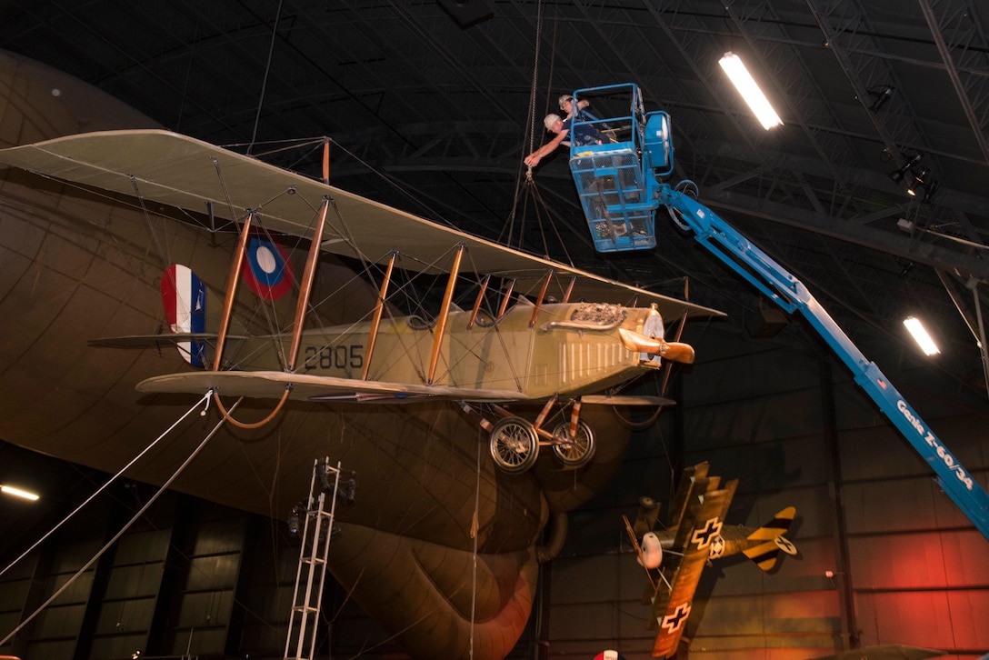 DAYTON, Ohio -- National Museum of the U.S. Air Force restoration crews lowered the Curtiss JN-4D Jenny from its hanging position on Nov. 7 2018 in the Early Years Gallery. Plans call for the Avro 504K to hang above the JN-4D after the restoration process is completed. (U.S. Air Force photo by Ken LaRock)