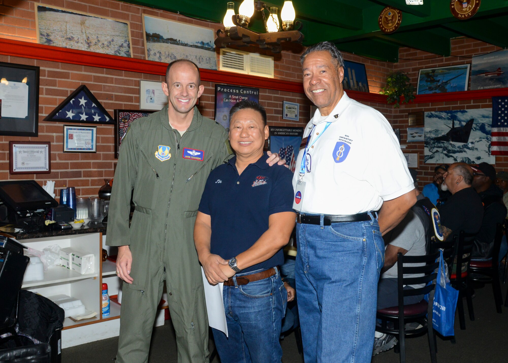 Brig. Gen. E. John Teichert, 412th Test Wing commander, Jin Hur, Crazy Otto’s Diner owner, and Juan Blanco, Coffee4Vets president, pose for a photo during a Coffee4Vets gathering at Crazy Otto’s Diner in Lancaster, California, Nov. 6. Coffee4Vets meet every Tuesday at the restaurant for fellowship and camaraderie. (U.S. Air Force photo by Giancarlo Casem)