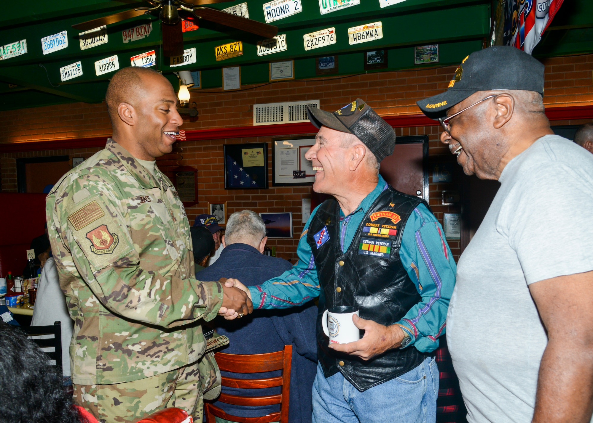 Command Chief Master Sgt. Roosevelt Jones, 412th Test Wing command chief master sergeant, greets local Veterans at a Coffee4Vets gathering at Crazy Otto’s Diner in Lancaster, California, Nov. 6. Coffee4Vets meet every Tuesday at the restaurant for fellowship and camaraderie. (U.S. Air Force photo by Giancarlo Casem)