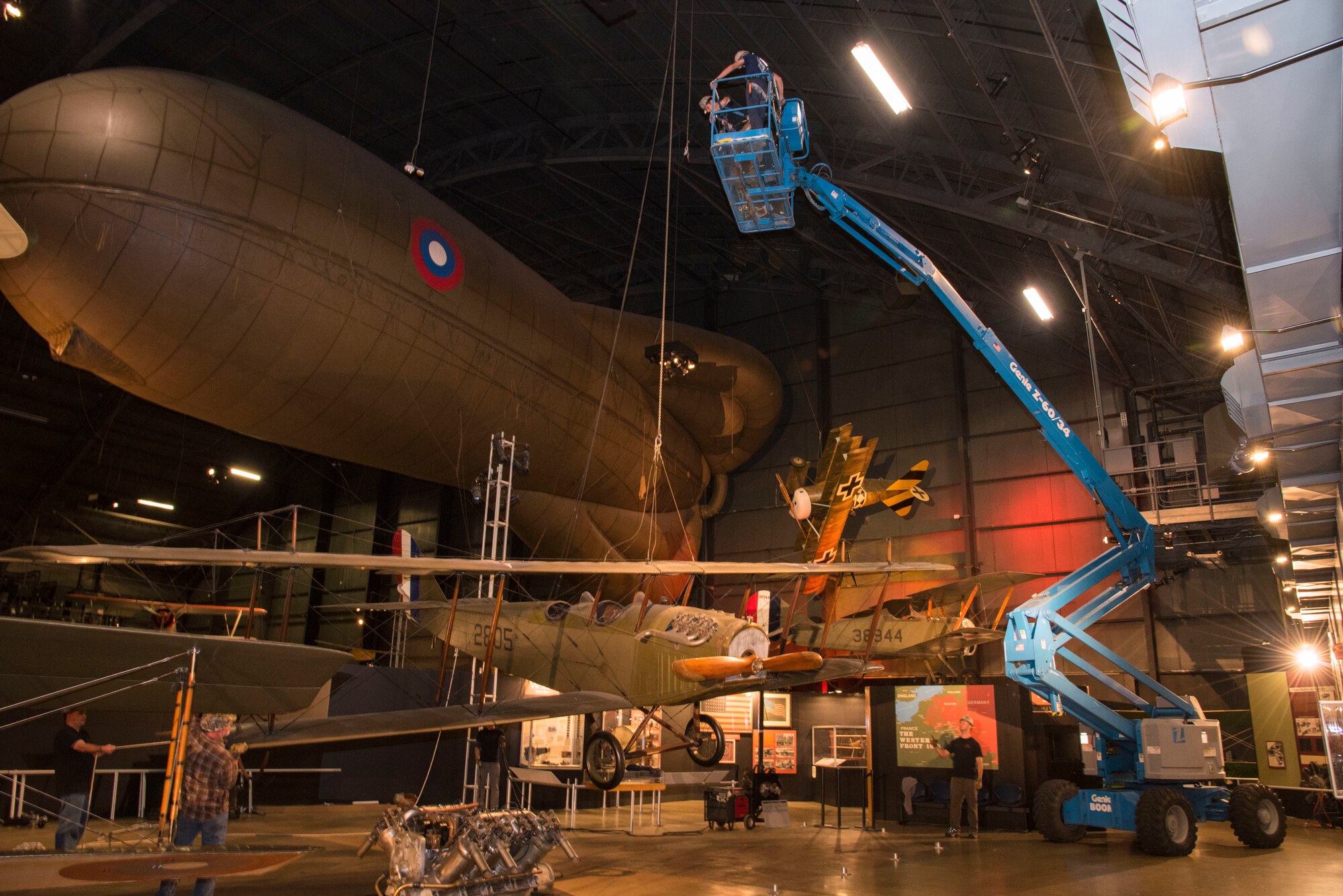 DAYTON, Ohio -- National Museum of the U.S. Air Force restoration crews lowered the Curtiss JN-4D Jenny from its hanging position on Nov. 7 2018 in the Early Years Gallery. Plans call for the Avro 504K to hang above the JN-4D after the restoration process is completed. (U.S. Air Force photo by Ken LaRock)