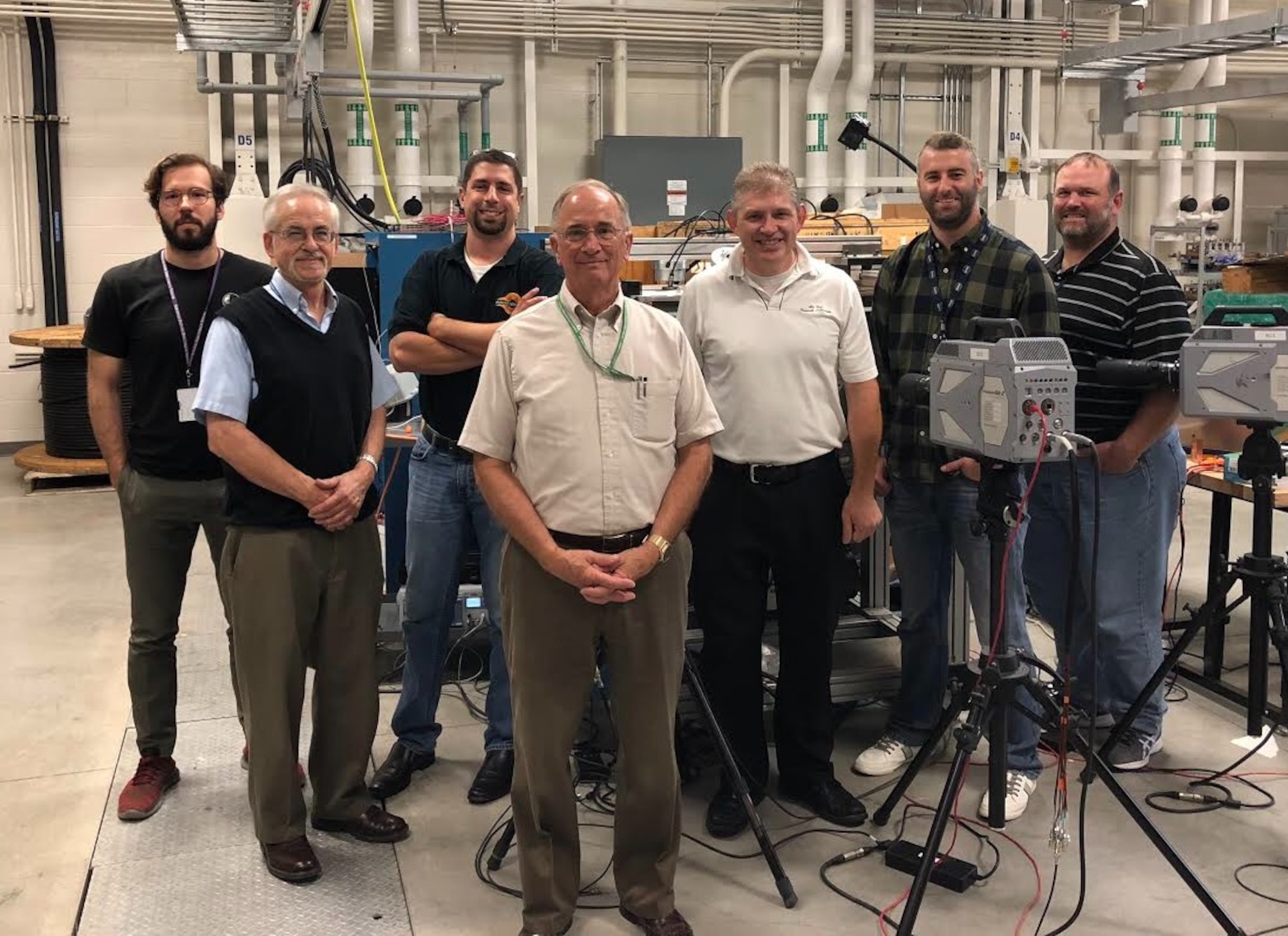 AFRL and NASA researchers teamed to conduct low-pressure arc fault testing in support of a NASA effort to determine the effects of arcing in Earth-orbit conditions. Pictured from left to right:  Erick Rossi De La Fuente, Dan Schweickart, Christopher Kostyk, Dennis Grosjean, Brett Jordan, Corey Boltz, and Dan O’Brien. (U.S. Air Force Photo/Richard Ryman)