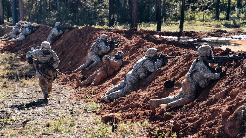 U.S. Army Sergeant Joseph Mcdermott, 331st Transportation Company, 11th Trans. Battalion, 7th Trans. Brigade (Expeditionary) watercraft operator, runs to support his squad in a simulated opposing force attack during Area Defense training at Fort Pickett, Virginia, Oct. 29, 2018.