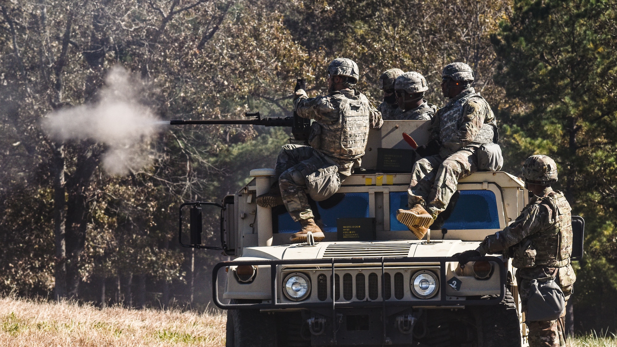 U.S. Army Soldiers assigned to 11th Transportation Battalion, 7th Trans. Brigade (Expeditionary), fire a mounted .50-caliber machine gun during a Combat Live Fire exercise at Fort Pickett, Virginia, Oct. 29, 2018.