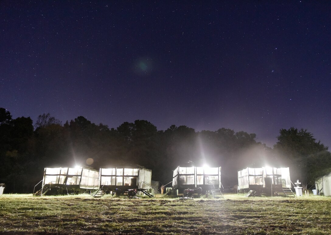 U.S. Army Soldiers assigned to the 11th Transportation Battalion, 7th Trans. Brigade (Expeditionary), start prepping meals early in the morning in the Mobile Kitchen Trailer at Fort Pickett, Virginia, Oct. 30, 2018.