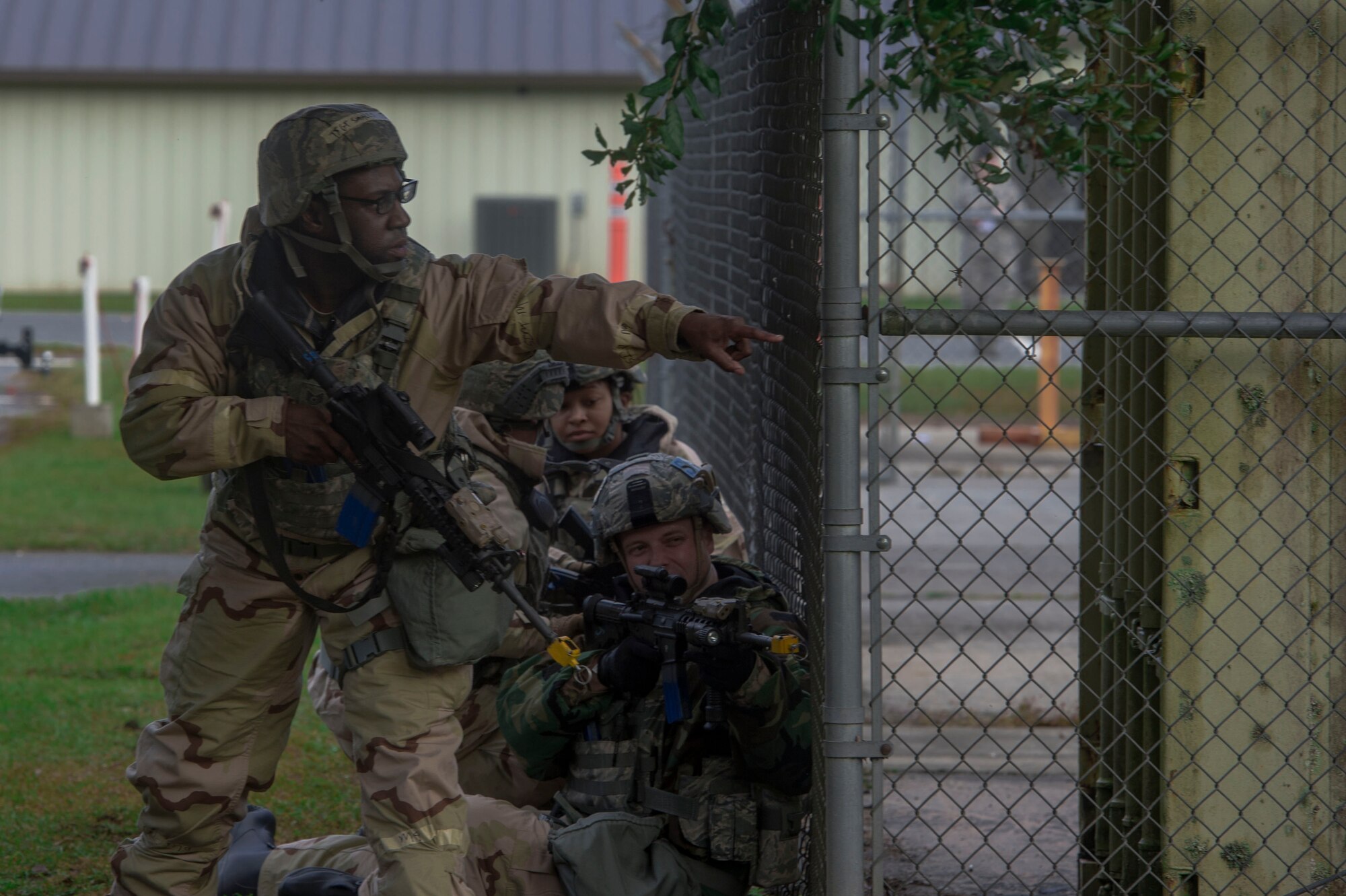 23d Security Forces Squadron defenders fend off mock insurgents during exercise Flying Tigers 19-01C, Nov. 6, 2018, at Moody Air Force Base, Ga. The weeklong event is the second phase of a contingency operation exercise which tests Moody Airmen on their ability to successfully survive in a contested and degraded operational environment while donning mission-oriented protective posture (MOPP) gear. (U.S. Air Force photo by Senior Airman Greg Nash)
