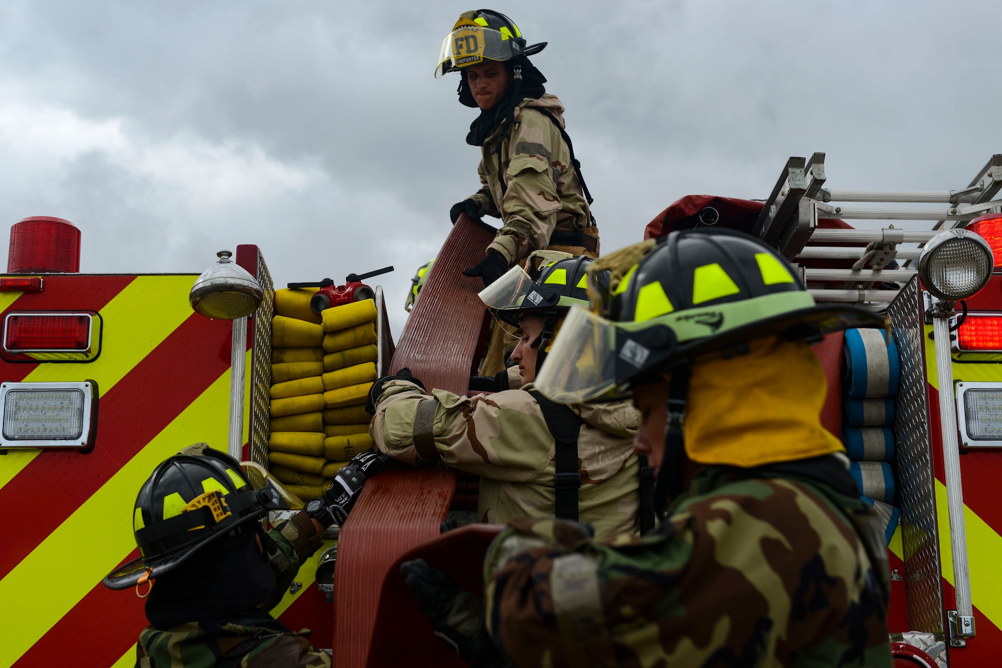 Airmen from the 23d Civil Engineer Squadron work together to pack a fire truck after a simulated building fire during exercise Flying Tigers 19-01C, Nov. 6, 2018, at Moody Air Force Base, Ga. The five-day exercise, scheduled to take place Nov. 5-9, will give base personnel an opportunity to experience contingency operations in a contested and degraded combat environment. (U.S. Air Force photo by Airman 1st Class Erick Requadt)