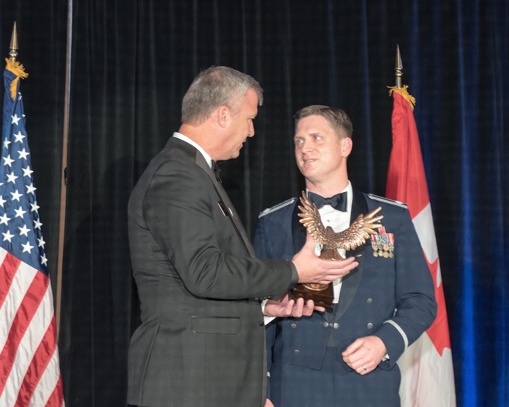 U.S. Air Force Lt. Col. Jared Clay (right), Chief Surgeon, Air Force Academy, Colorado, received the Patriot Award at the annual National Defense Industrial Association’s ball, sponsored by the association’s Rocky Mountain Chapter, Nov. 2, 2018. Clay was honored for his actions in Afghanistan earlier this year. (Courtesy photo)