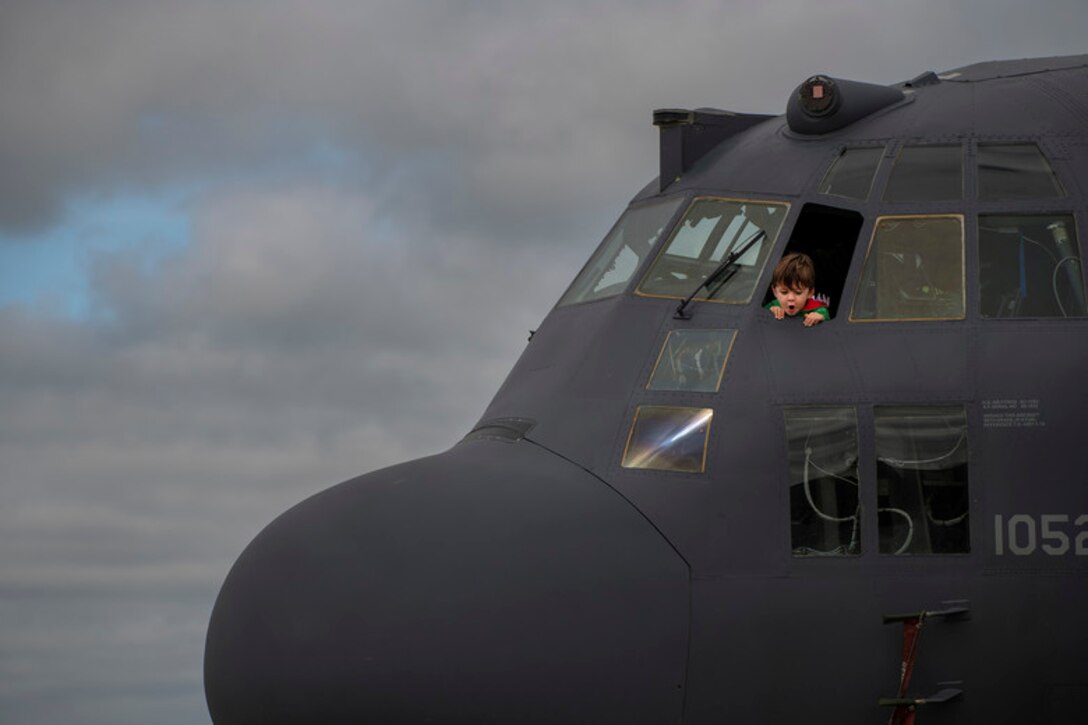 Joseph, a military dependent, gazes down from the flight deck of an AC-130U during the Master Sgt. John A. Chapman Medal of Honor Celebration Oct. 27, 2018, at Hurlburt Field, Fla. Hurlburt Field hosted a three-day celebration to commemorate the legacy of Chapman, a combat controller who was the 19th Airman to receive the Medal of Honor and the first Airman to be recognized with the decoration since the Vietnam War. (U.S. Air Force photo by Staff Sgt. Peter Thompson)