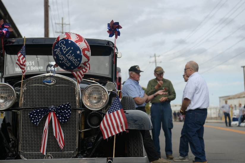 A group of men stand next to a 1931 Ford Model A as they wait to line up in the Veterans Day Parade Nov. 4, 2018, in Charleston, S.C. The car was decorated for the city’s annual Veteran’s Day Parade. This year’s Veterans Day, officially recognized Nov. 11, 2018, will mark the 100th anniversary of the end of the First World War.