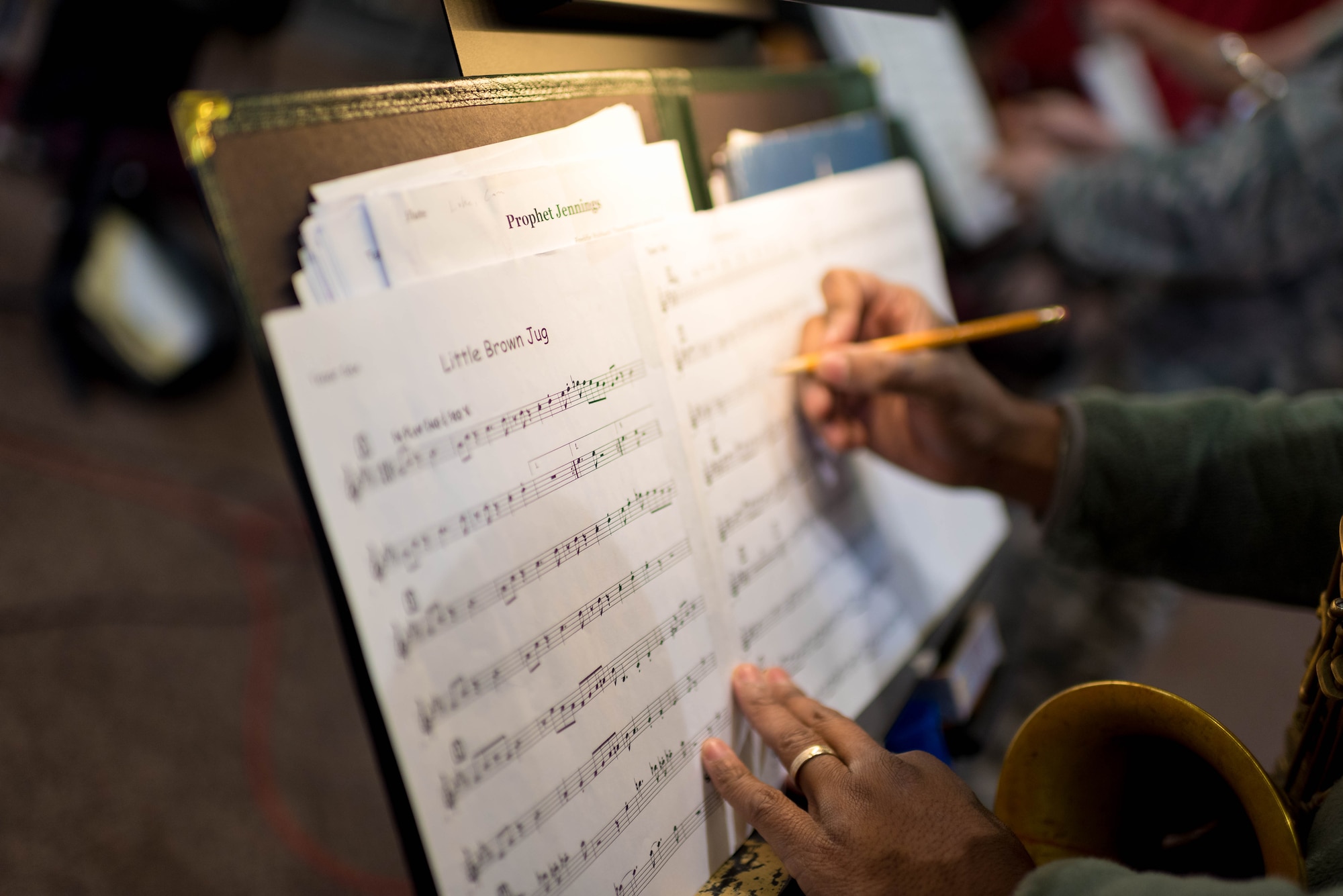 Master Sgt. Grant Langford marks in his music during rehearsal for the Airmen of Note 2018 Fall Tour