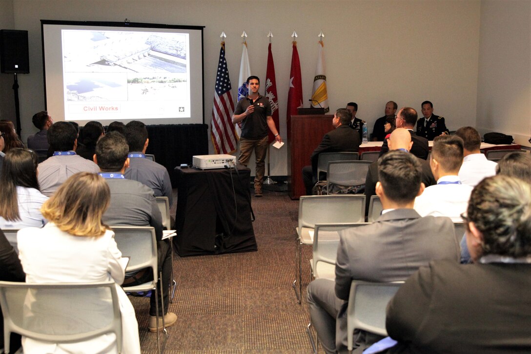 Chad Allen, a resident engineer with Los Angeles District, talks to college students and recent graduates attending the USACE seminar at the Hispanic Engineer Achievement Awards Corporation conference Oct. 19 in Pasadena, California. With the theme, "Travel the world ... make an impact ... build big things," panel members presented information on the Corps, its missions and the opportunities a Corps career provides employees.