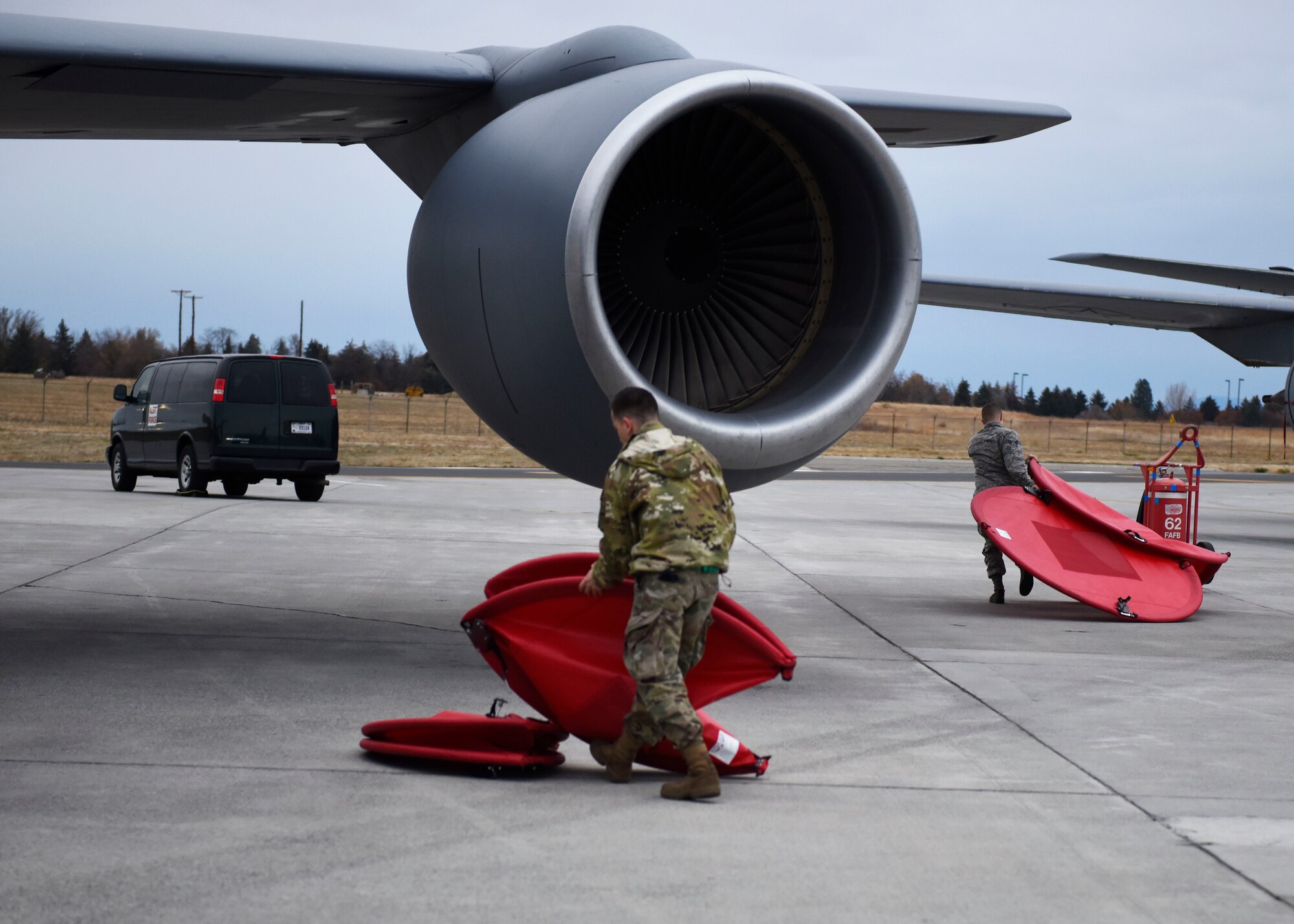 Staff Sgt. Austin Garcia and Senior Airman Dan O'Connor, 92nd Aircraft Maintenance Squadron crew chiefs, remove engine covers as part of an alert response during Exercise Global Thunder 2019 at Fairchild Staff Sgt. Austin Garcia and Senior Airman Dan O'Connor, 92nd Aircraft Maintenance Squadron crew chiefs, remove engine covers as part of an alert response during Exercise Global Thunder 2019 at Fairchild Air Force Base, Washington, November 2018. Global Thunder is a U.S. Strategic Command exercise designed to ensure an efficient mission response by testing Airmen's ability to execute command, control and operational procedures during simulated combat scenarios. (U.S. Air Force photo/Airman 1st Class Lawrence Sena)