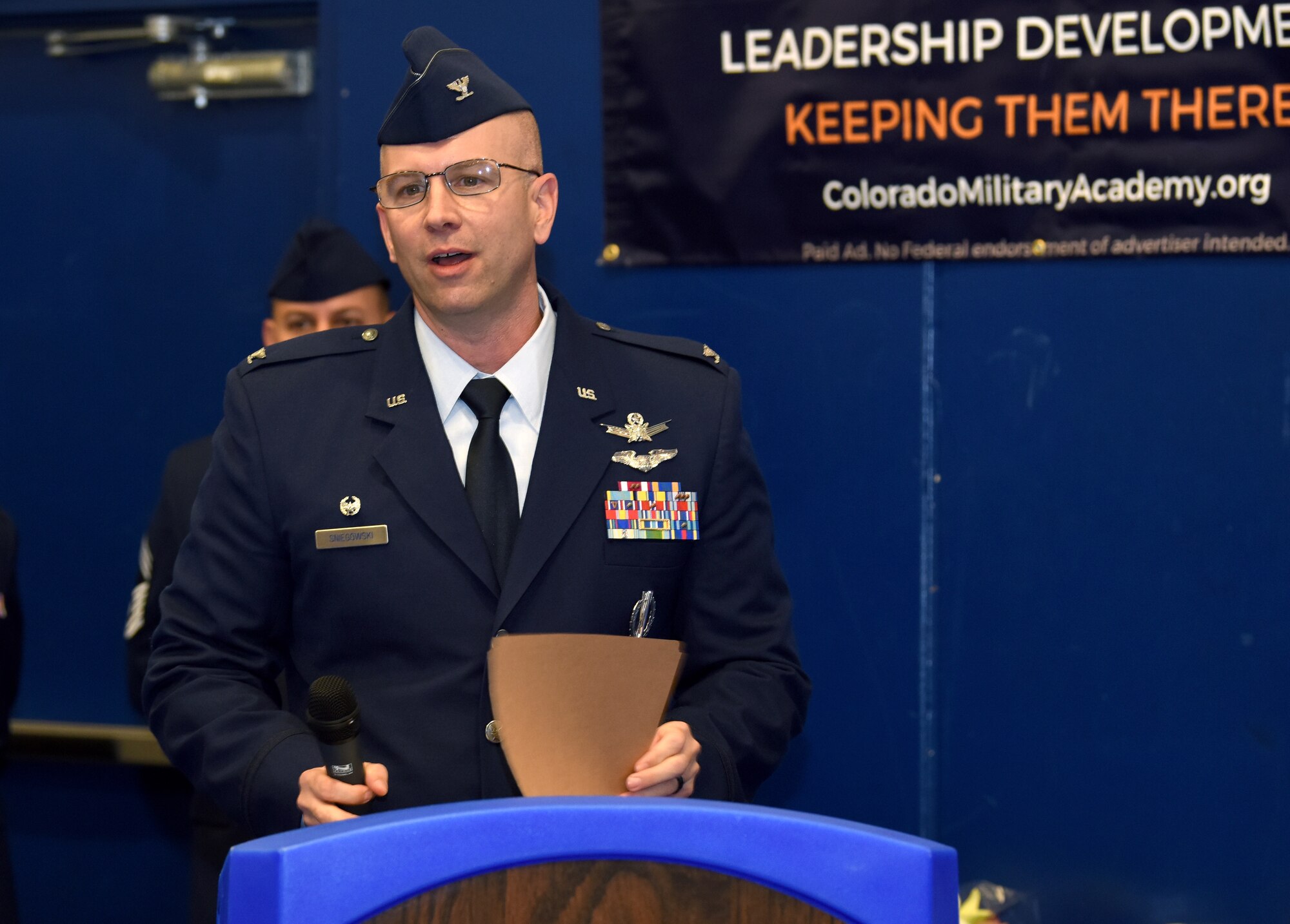 Col. Dean D. Sniegowski, incoming 310th Space Wing commander, addresses members of the wing during a change of command ceremony, Nov. 3rd, 2018