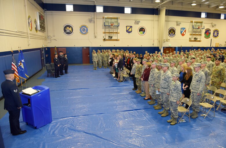 Members of the 310th Space Wing watch as Col. Traci L. Kueker-Murphy relinquishes command to Col. Dean D. Sniegowski during a change of command ceremony, Nov. 3rd, 2018