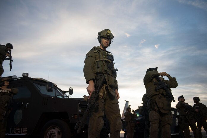 Andrew C. Latendresse, North Las Vegas Police Officer, stands on the flightline at Nellis Air Force Base, Nevada, Nov. 2, 2018. The North Las Vegas Police Department’s mission is to encourage and engage the community to work as one in order to provide a safe, secure, and enjoyable community. (U.S. Air Force photo by Airman 1st Class Bryan T. Guthrie)