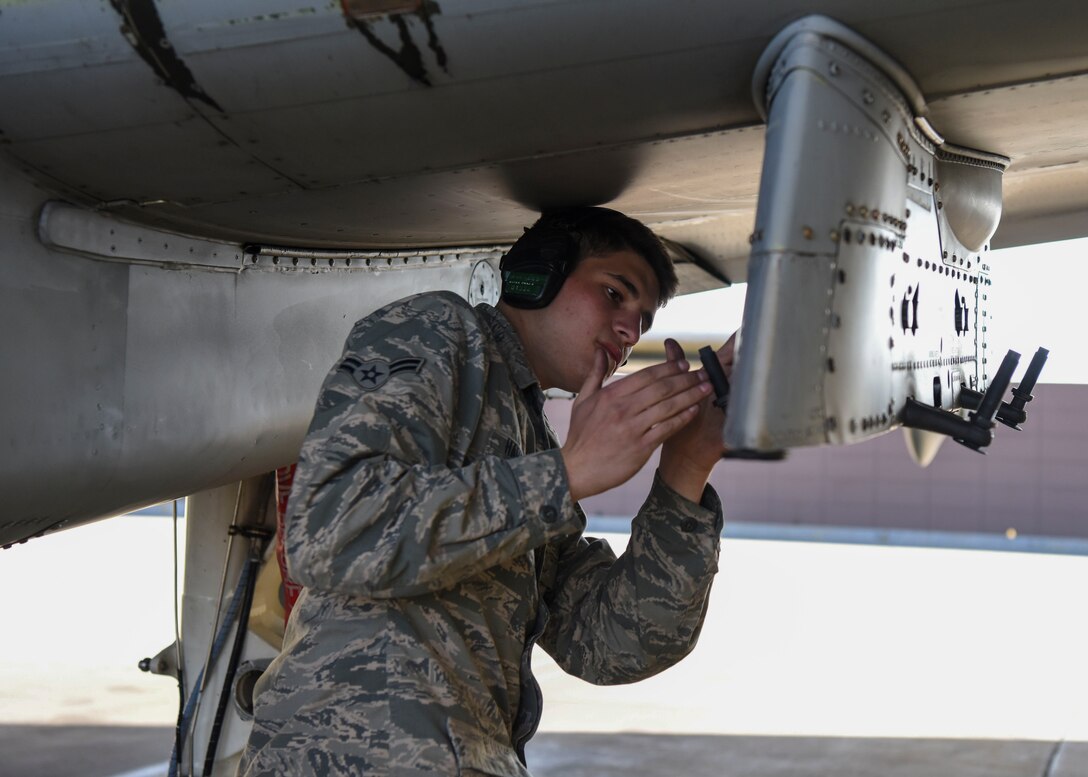U.S. Air Force Airman 1st Class Shane Harkness, 51st Maintenance Group standardized load crew team member, prepares an aircraft for loading munitions at Osan Air Base, Republic of Korea, Nov. 2, 2018. To minimize the down time of  aircraft during exercises and real world contingencies, the crew performed a loading operation with the aircraft engines running after hot refueling. (U.S. Air Force photo by Airman 1st Class Ilyana A. Escalona)