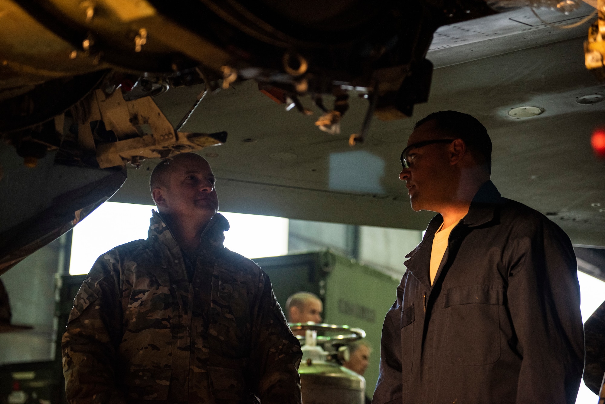 U.S. Air Force Staff Sgt. Joseph Gallegos, 309th Aircraft Maintenance Group depot structural maintenance specialist (right) from Hill Air Force Base, Utah, explains various components of an F-16 Fighting Falcon intake to Col. John Bosone, 8ith fighter Wing commander (left), at Kunsan Air Base, Republic of Korea, Nov. 8, 2018. The replacement is part of a maintenance initiative to structurally repair dated parts on some of the F-16s and enhance the lethality of the Wolf Pack fleet. (U.S. Air Force photo by Senior Airman Stefan Alvarez)