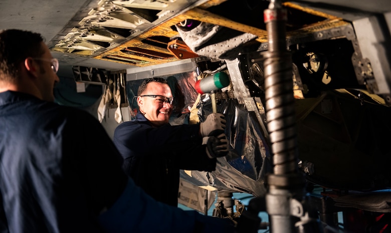 U.S. Air Force Staff Sgt. Joseph Gallegos, 309th Aircraft Maintenance Group depot structural maintenance specialist (right), and Tech. Sgt. Tyler Stratman, 309th AMXG depot structural maintenance specialist (left), from Hill Air Force Base, Utah, attempts to remove the bulkhead from an F-16 Fighting Falcon at Kunsan Air Base, Republic of Korea, Nov. 8, 2018. The replacement is part of a maintenance initiative to structurally repair dated parts on some of the F-16s and enhance the lethality of the Wolf Pack fleet. (U.S. Air Force photo by Senior Airman Stefan Alvarez)