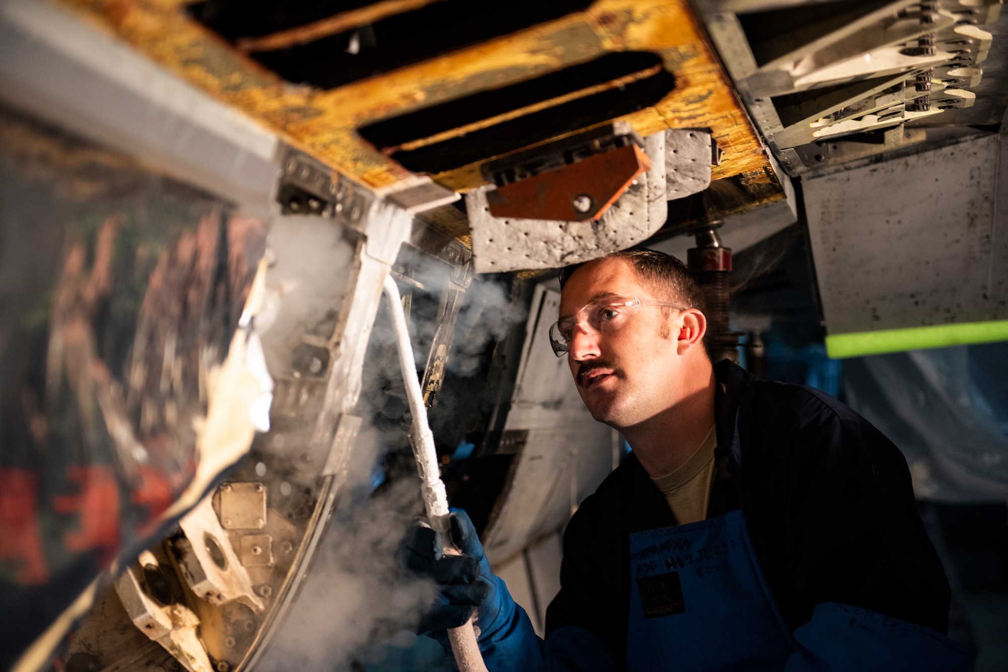 U.S. Air Force Tech. Sgt. Tyler Stratman, 309th Aircraft Maintenance Group depot structural maintenance specialist from Hill Air Force Base, Utah, sprays the bulkhead of an F-16 Fighting Falcon with liquid nitrogen at Kunsan Air Base, Republic of Korea, Nov. 8, 2018. Multiple components on aircraft had to be replaced in order to maintain the lifespan, keep them operational, and sharpen the lethality of the Wolf Pack fleet. (U.S. Air Force photo by Senior Airman Stefan Alvarez)