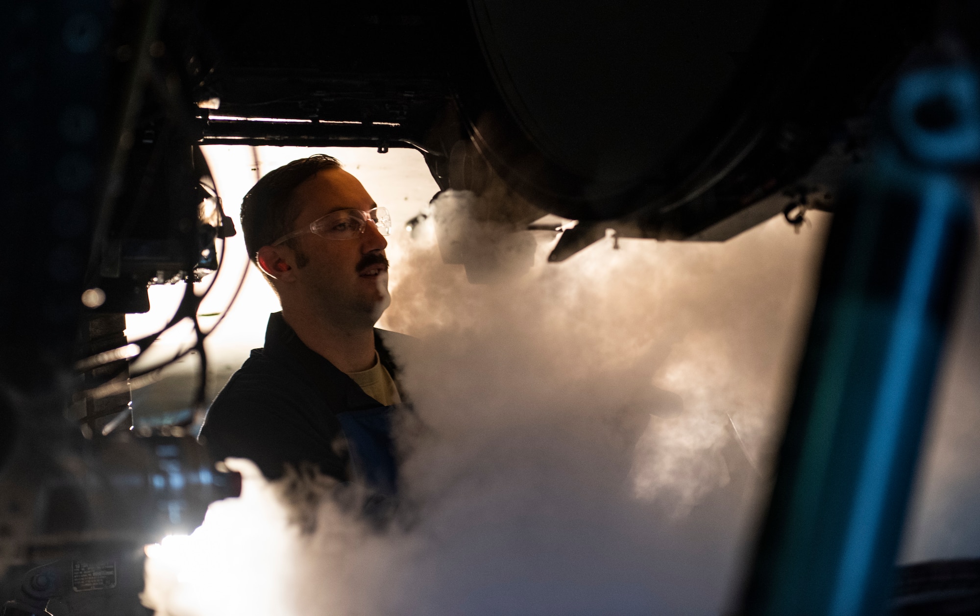 U.S. Air Force Tech. Sgt. Tyler Stratman, 309th Aircraft Maintenance Group depot structural maintenance specialist from Hill Air Force Base, Utah, sprays the bulkhead of an F-16 Fighting Falcon with liquid nitrogen at Kunsan Air Base, Republic of Korea, Nov. 8, 2018. Due to normal wear and tear after years of flying and performing combat and training operations, the bulkhead had to be replaced in order to maintain the F-16 Fighting Falcon’s lethality. (U.S. Air Force photo by Senior Airman Stefan Alvarez)