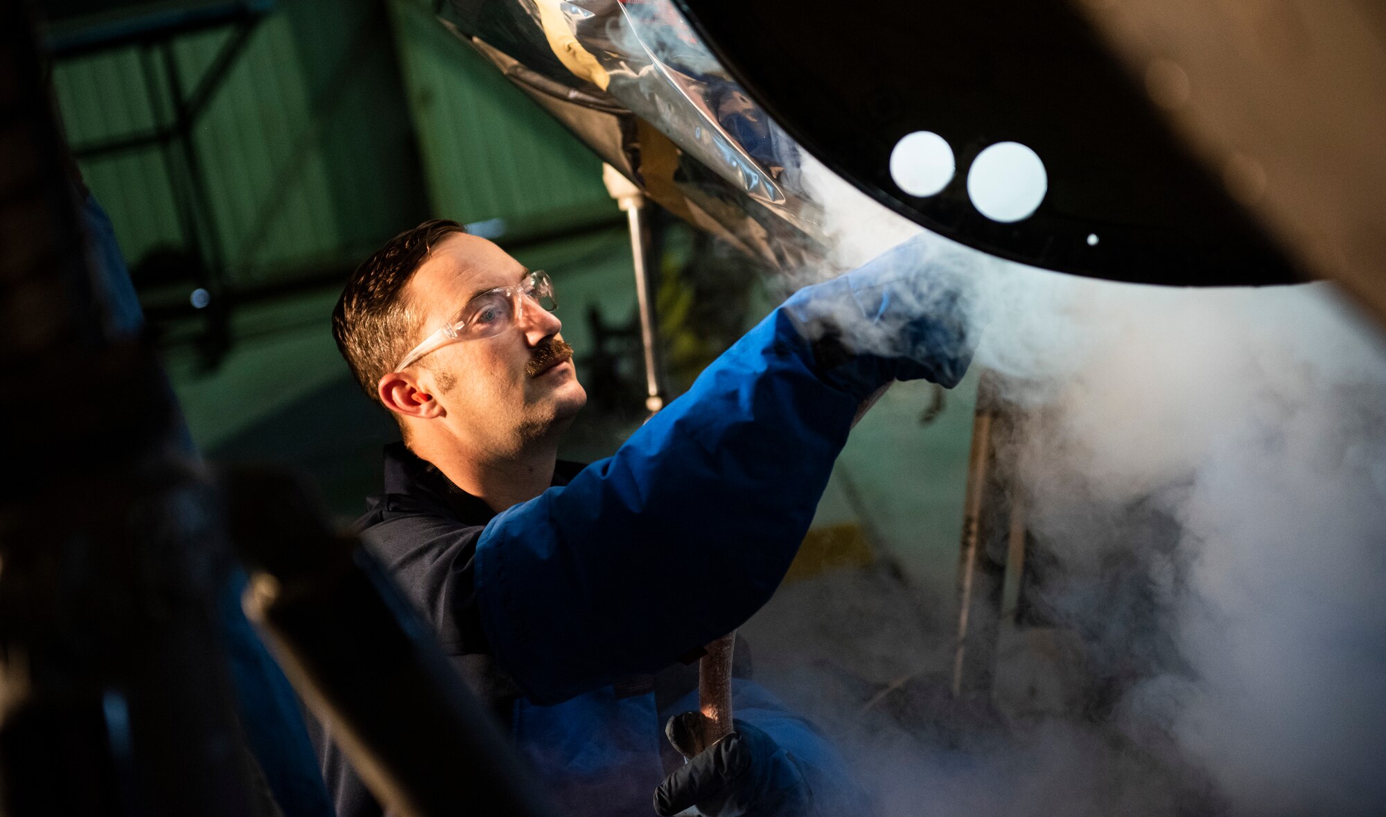U.S. Air Force Tech. Sgt. Tyler Stratman, 309th Aircraft Maintenance Group depot structural maintenance specialist from Hill Air Force Base, Utah, sprays the bulkhead of an F-16 Fighting Falcon with liquid nitrogen at Kunsan Air Base, Republic of Korea, Nov. 8, 2018. Multiple components on aircraft have to be replaced in order to maintain the lifespan, keep them operational, and sharpen the lethality of the Wolf Pack fleet. (U.S. Air Force photo by Senior Airman Stefan Alvarez)