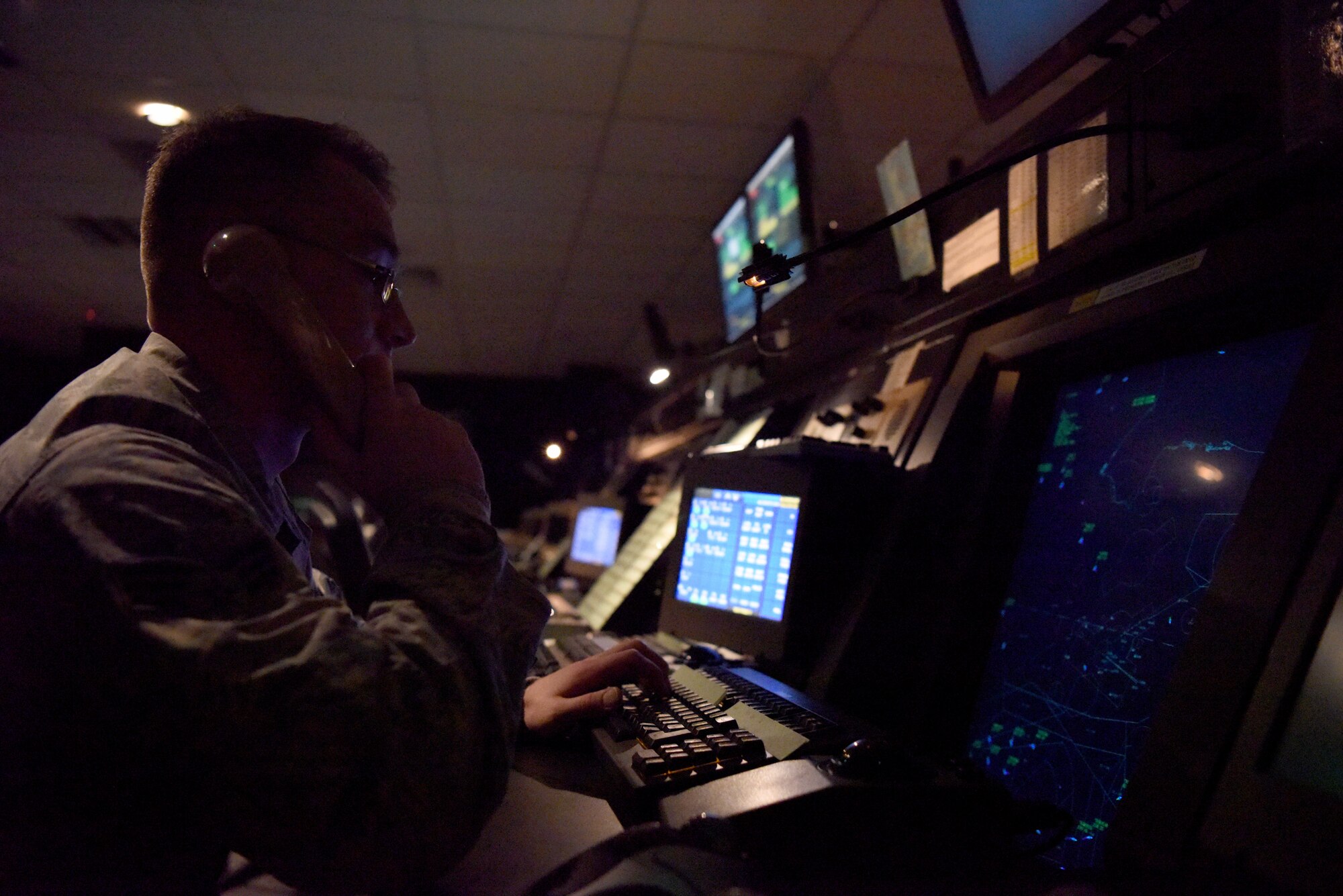 An Airman from the 48th Operations Support Squadron Radar Approach Control monitors air traffic around Royal Air Force Lakenheath, England, Oct. 03, 2018. Airmen from the Radar, Airfield and Weather Systems flight ensure that every sensor and piece of monitoring equipment is calibrated and accurate to provide RAPCON with a precise picture of the surrounding airspace.  (U.S. Air Force photo by Senior Airman John A. Crawford)