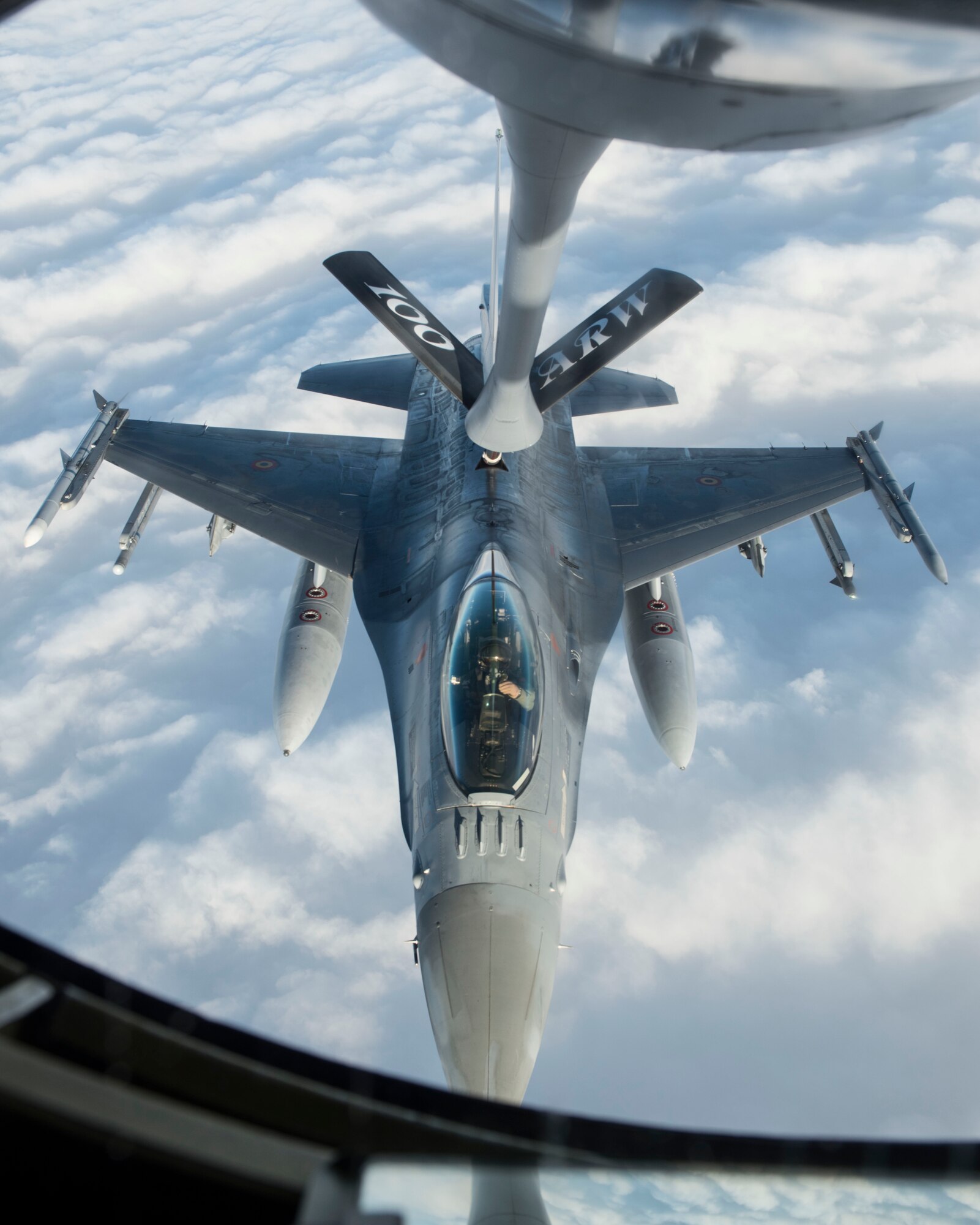 A Belgian F-16 Fighting Falcon receives fuel from a U.S. Air Force KC-135 Stratotanker during Exercise Trident Juncture 18, in Swedish airspace, Oct. 30, 2018. The exercise is the largest NATO exercise since 2002, and includes more than 50,000 military members from 31 countries. The exercise provides U.S. forces with unique opportunities to train with NATO allies and partners. (U.S. Air Force photo by Senior Airman Luke Milano)(U.S. Air Force photo by Senior Airman Luke Milano)
