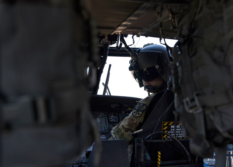 A UH-60 Black Hawk crew member from the Arizona Army National Guard checks on the service members aboard during a joint training exercise at Glendale Municipal Airport Nov. 2, 2018, in Glendale, Ariz.
