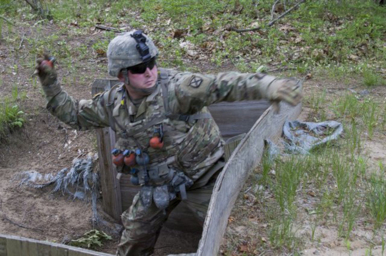U.S. Army Spc. Andres Diaz, Detachment 1, Alpha Company, 572nd Brigade Engineer Battalion, 86th Infantry Brigade Combat Team (Mountain), Vermont National Guard, throws a training grenade at Fort Drum, N.Y., June 13, 2017.  The Vermont Guard is a finalist in the Army Communities of Excellence.