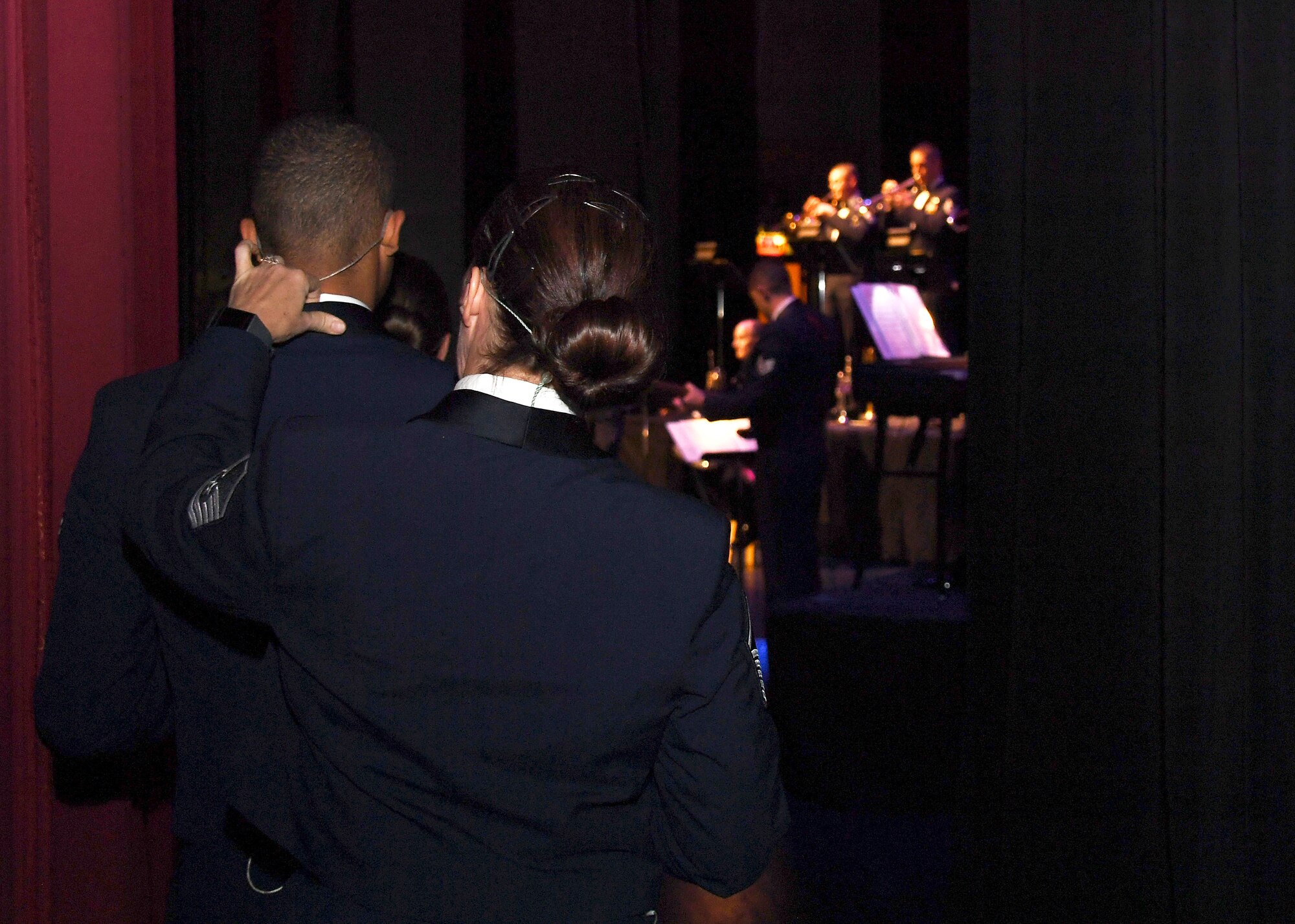 Master Sgt. Rebecca Wischmann, vocalist with the U.S. Air Force Heartland of America Band, adjusts Airman 1st Class Mario Foreman-Powell’s collar, a fellow vocalist in the band, prior to heading onstage for a concert November 6, 2018, at the Chester Fritz Auditorium in Grand Forks, North Dakota. The Heartland of America Band held a special Veterans Day performance to commemorate and celebrate all service members, past and present. (U.S. Air Force photo by Airman 1st Class Elora J. Martinez)