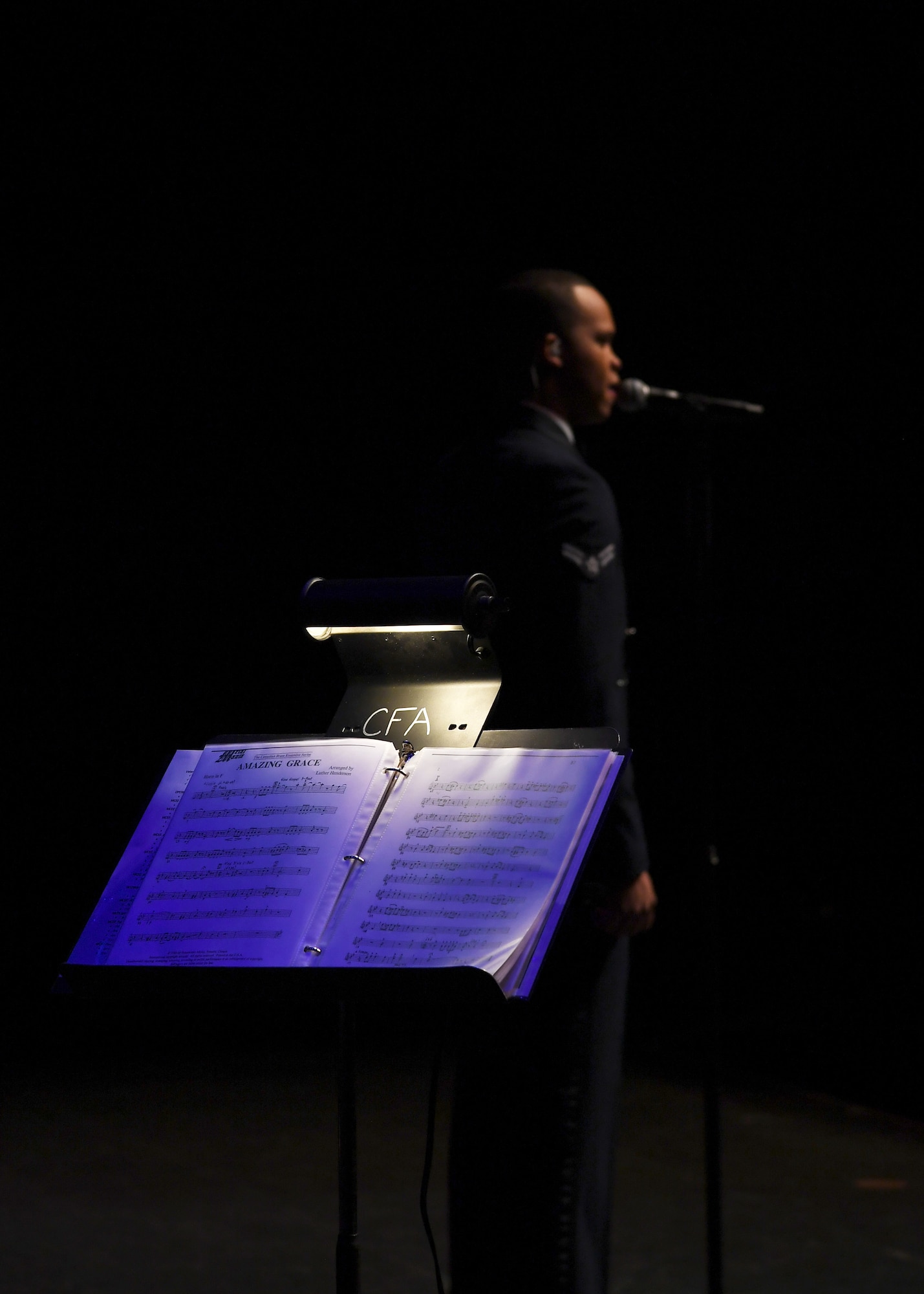 Airman 1st Class Mario Foreman-Powell, U.S. Air Force Heartland of America Band vocalist, sings for a crowd of about 700 people during a special Veterans Day concert honoring veterans and military service members November 6, 2018, at the Chester Fritz Auditorium in Grand Forks, North Dakota. Comprised of nine musicians and three vocalists, the band travels the country performing in a wide variety of venues to demonstrate Air Force excellence and precision. (U.S. Air Force photo by Airman 1st Class Elora J. Martinez)
