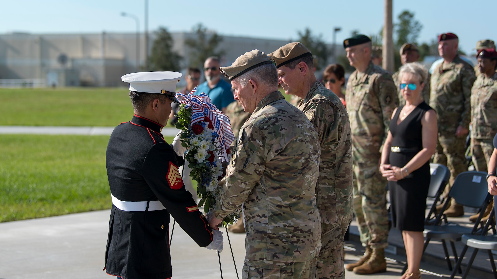 U.S. Army General Raymond Thomas, center, U.S. Special Operations Command commander, and U.S. Army General Joseph Votel, right, U.S. Central Command commander, receive a ceremonial wreath during a joint-service Veterans Day ceremony held at MacDill Air Force Base, Fla., Nov. 8, 2018. Veterans Day is commemorated with remembrance events, parades, and wreath laying ceremonies to honor those who have served and continue to serve.