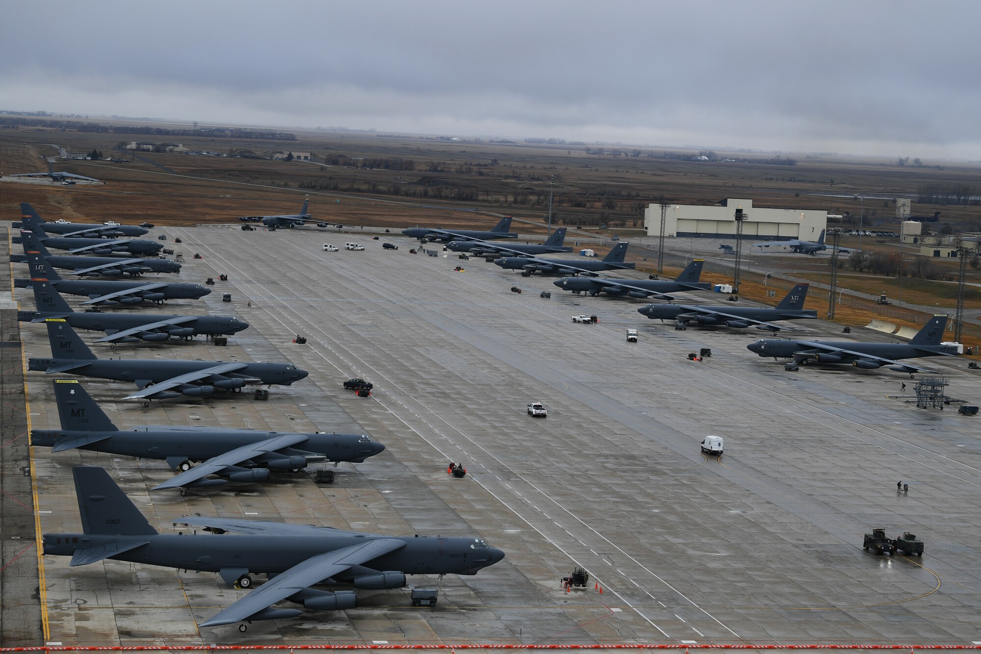 Rows of B-52H Stratofortresses sit ready on the flightline during Global Thunder 19 at Minot Air Force Base, N.D., Nov. 2, 2018. Global Thunder is a U.S. Strategic Command (USSTRATCOM) exercise designed to provide training opportunities to test and validate command, control and operational procedures. The training is based on a notional scenario developed to drive execution of USSTRATCOM and component forces'; ability to support the geographic combatant commands, deter adversaries and, if necessary, employ forces as directed by the President of the United States. (U.S. Air Force photo by Tech. Sgt. Jarad A. Denton)