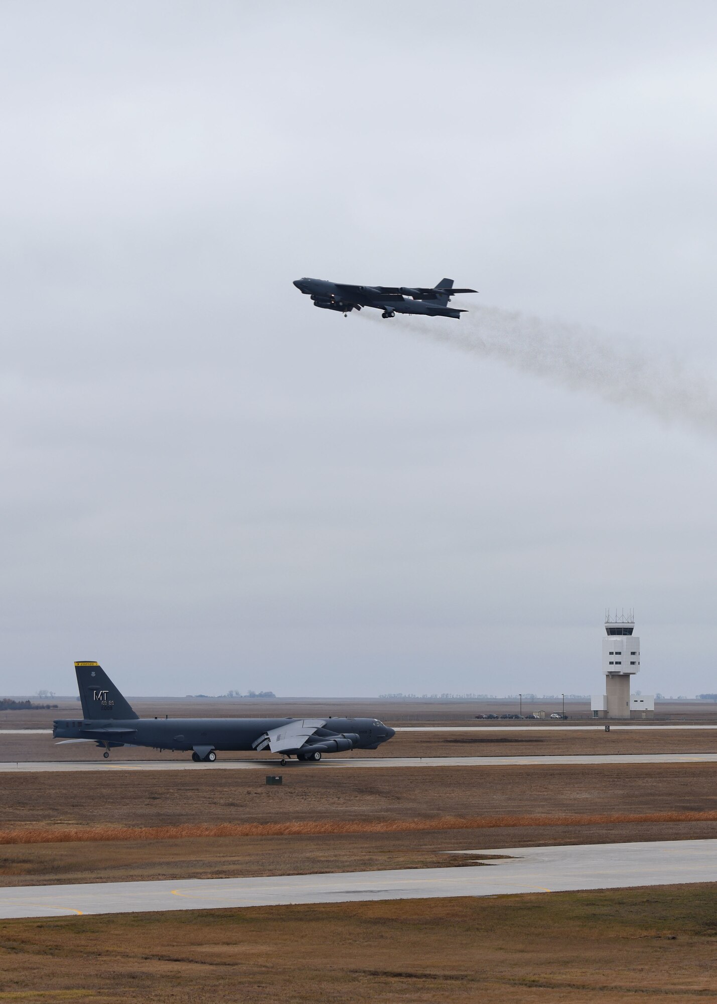 Two B-52H Stratofortresses pass each other during Global Thunder 19 at Minot Air Force Base, N.D., Nov. 4, 2018. Global Thunder is an annual U.S. Strategic Command (USSTRATCOM) exercise designed to provide training opportunities to test and validate command, control and operational procedures. The training is based on a notional scenario developed to drive execution of USSTRATCOM and component forces'; ability to support the geographic combatant commands, deter adversaries and, if necessary, employ forces as directed by the President of the United States. (U.S. Air Force Photo by Airman 1st Class Dillon J. Audit)