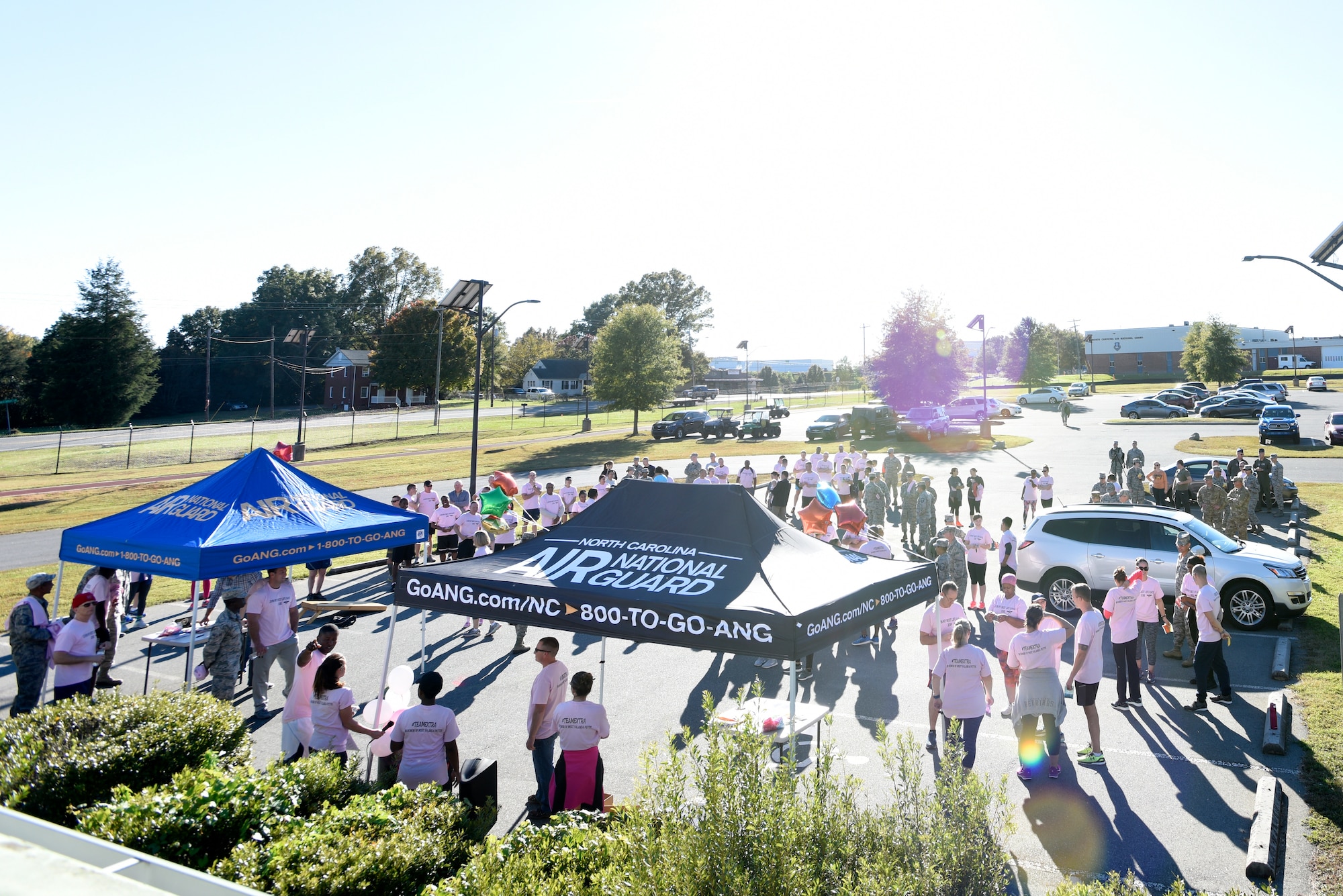 Members of the North Carolina Air National Guard come together during a 1-mile walk/run to support family and friends of recently deceased U.S. Air Force Recruiter Master Sgt. Valanda Pettis. Master Sgt. Pettis’ battle with cancer came to an end this Fall and to honor her memory, the NCANG Recruiting office hosted the Color Run, which involves a 1-mile walk/run with colorful chalk thrown in the air and on participants, to inspire cheer in those she left behind. The theme of the race, “Livin’ my best life,” is a phrase Pettis was often heard singing or using around her loved ones to instill faith, joy, and love.