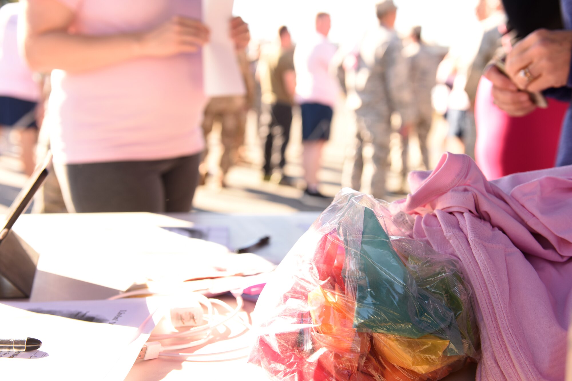 Members of the North Carolina Air National Guard come together during a 1-mile walk/run to support family and friends of recently deceased U.S. Air Force Recruiter Master Sgt. Valanda Pettis. Master Sgt. Pettis’ battle with cancer came to an end this Fall and to honor her memory, the NCANG Recruiting office hosted the Color Run, which involves a 1-mile walk/run with colorful chalk thrown in the air and on participants, to inspire cheer in those she left behind. The theme of the race, “Livin’ my best life,” is a phrase Pettis was often heard singing or using around her loved ones to instill faith, joy, and love.