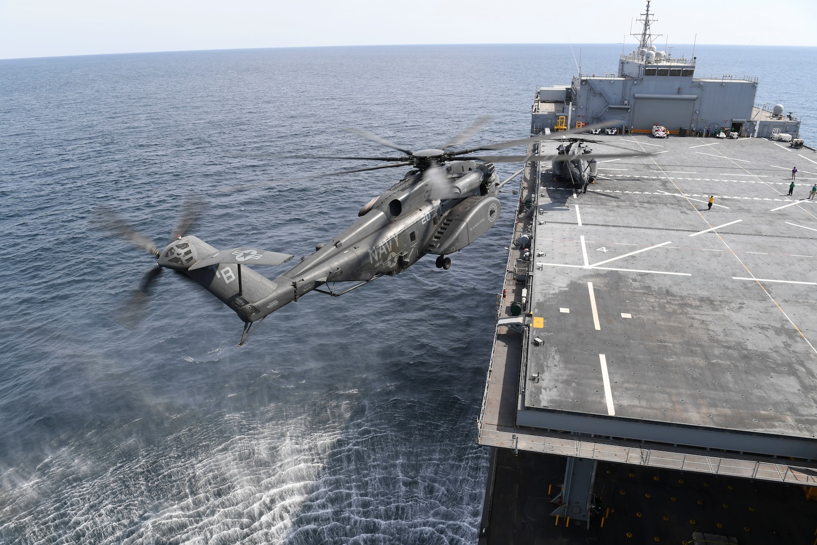 An MH-53E Sea Dragon, from Helicopter Mine Countermeasures Squadron (HM) 15, prepare to land on expeditionary mobile base platform ship USS Lewis B. Puller (ESB 3). Puller is deployed to the U.S. 5th Fleet area of operations in support of naval operations to ensure maritime stability and security in the Central Region, connecting the Mediterranean and the Pacific through the western Indian Ocean and three strategic choke points. (U.S. Navy photo by Mass Communication Specialist 2nd Class Kevin J. Steinberg/Released)
