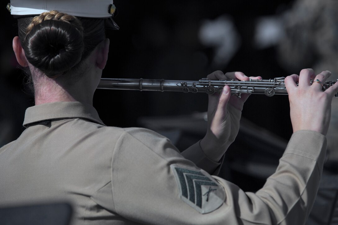 Sgt. Suzanne Farber, a flute instrumentalist with the 3rd Marine Aircraft Wing band, performs during a cake cutting ceremony at Marine Corps Air Station Miramar, Calif., Nov 7. Marines with 3rd Marine Aircraft wing and MCAS Miramar celebrated the 243rd Marine Corps birthday with a cake cutting ceremony. (U.S. Marine Corps photo by Sgt. Jake McClung)