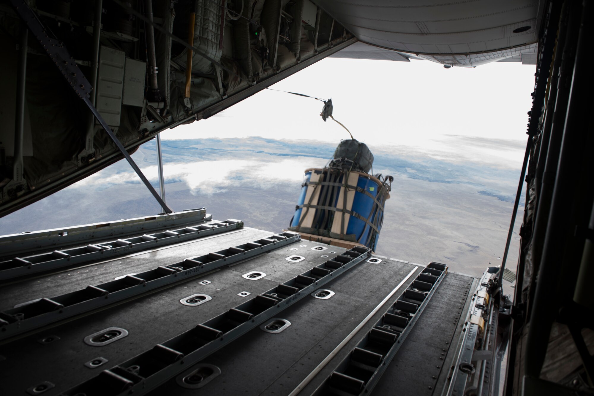 Image of GPS-guided cargo leaves a C-130J over Saylor Creek Range, Idaho, Nov. 1, 2018. GPS-guided cargo is a fairly new capability for the Royal Australian Air Force. (U.S. Air Force photo by Senior Airman Alaysia Berry)