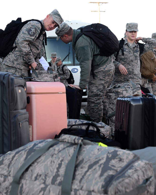 Airmen from the 37th Bomb Squadron and 28th Aircraft Maintenance Squadron gather their luggage outside the Deployment Readiness Center at Ellsworth Air Force Base, S.D., Oct. 25, 2018. The Airmen departed for Green Flag, an air-to-surface training exercise in various parts of Nevada and California.