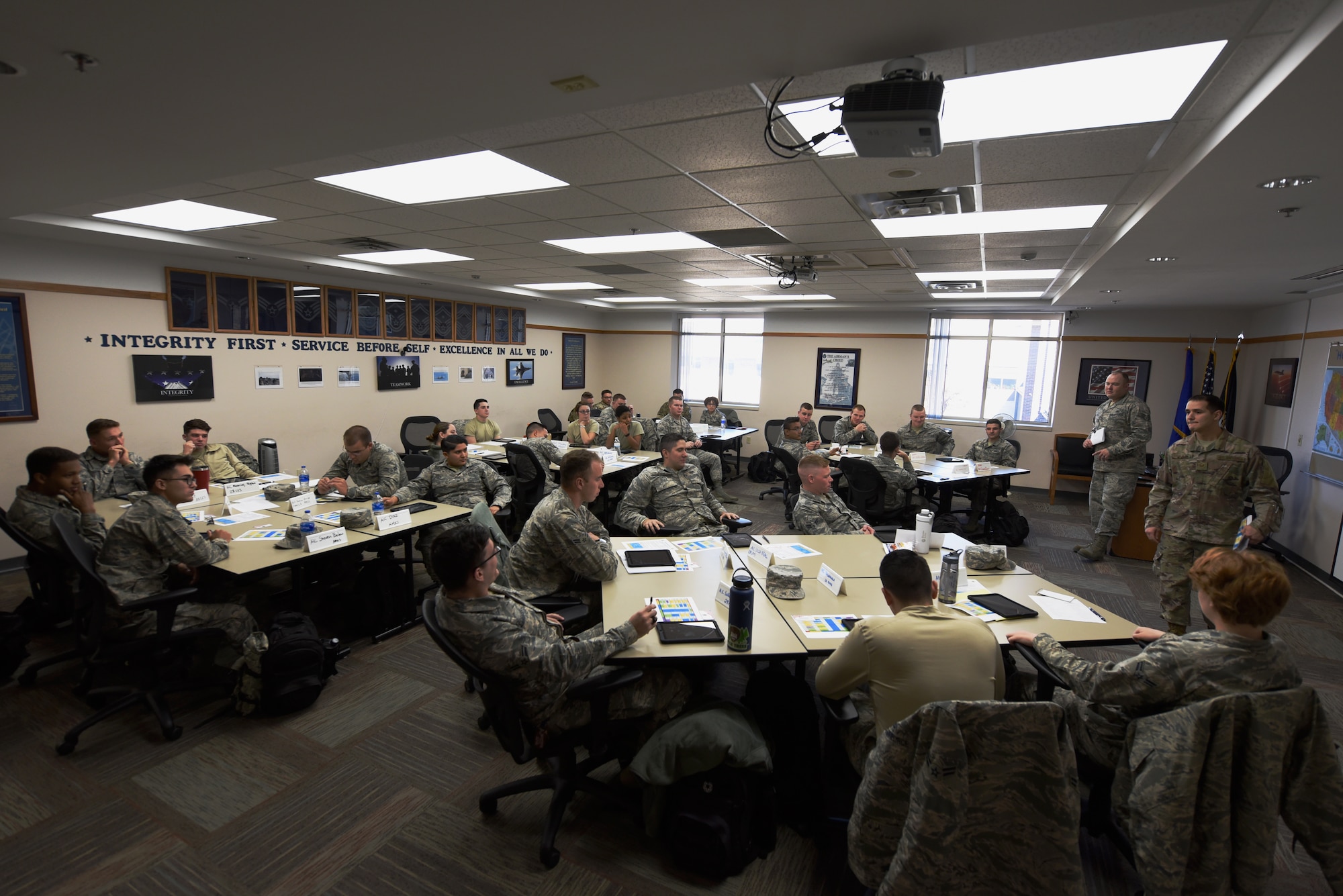 First-term Airmen participate in a group discussion during the First Term Airmen Course at the Rushmore Center on Ellsworth Air Force Base, S.D., Oct. 22, 2018. The FTAC course is a mandatory, weeklong program that is packed with professional development guidance, life-skills briefings and visits from base agencies to aid new Airmen with getting their careers started. (U.S. Air Force photo by Airman 1st Class Christina Bennett)