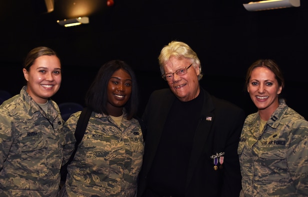 Dave Roever, Vietnam War veteran and Purple Heart recipient, poses for a photo with Team Mildenhall Airmen during a visit at RAF Mildenhall, England, Nov. 6, 2018. Roever presented a message of integrated resiliency and suicide prevention to Team Mildenhall Airmen. (U.S. Air Force photo by Airman 1st Class Brandon Esau)