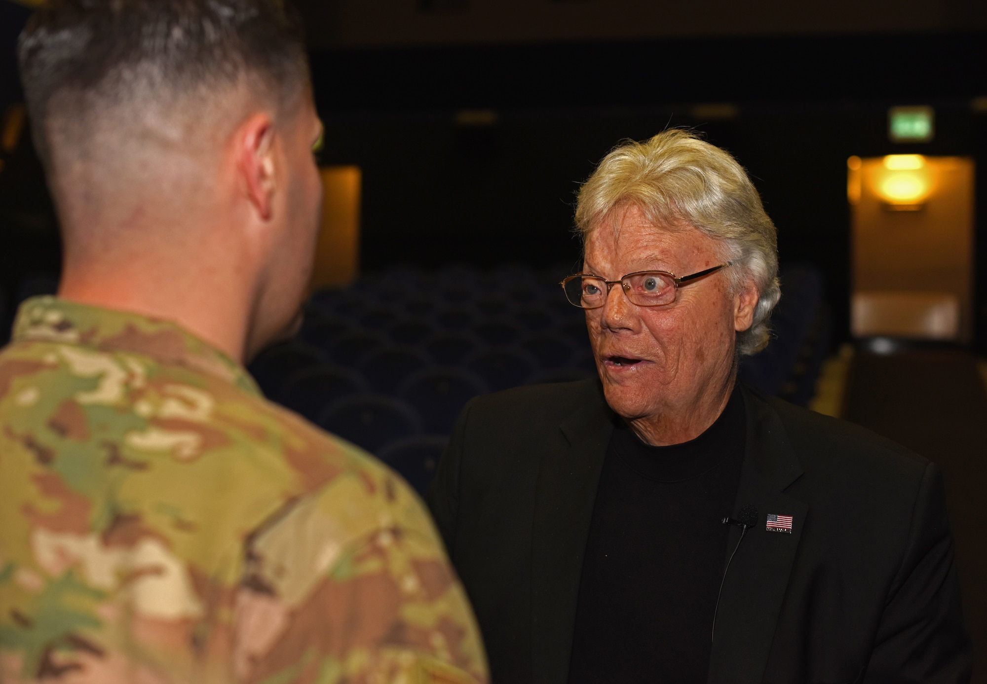 Dave Roever, Vietnam War veteran and Purple Heart recipient, speaks with U.S. Air Force Tech. Sgt. Marcelo Sierra, 100th Air Refueling Wing executive assistant to the command chief, during a visit at RAF Mildenhall, England, Nov. 6, 2018. Roever has taken his message of integrated resiliency and suicide prevention to troops around the globe. (U.S. Air Force photo by Airman 1st Class Brandon Esau)