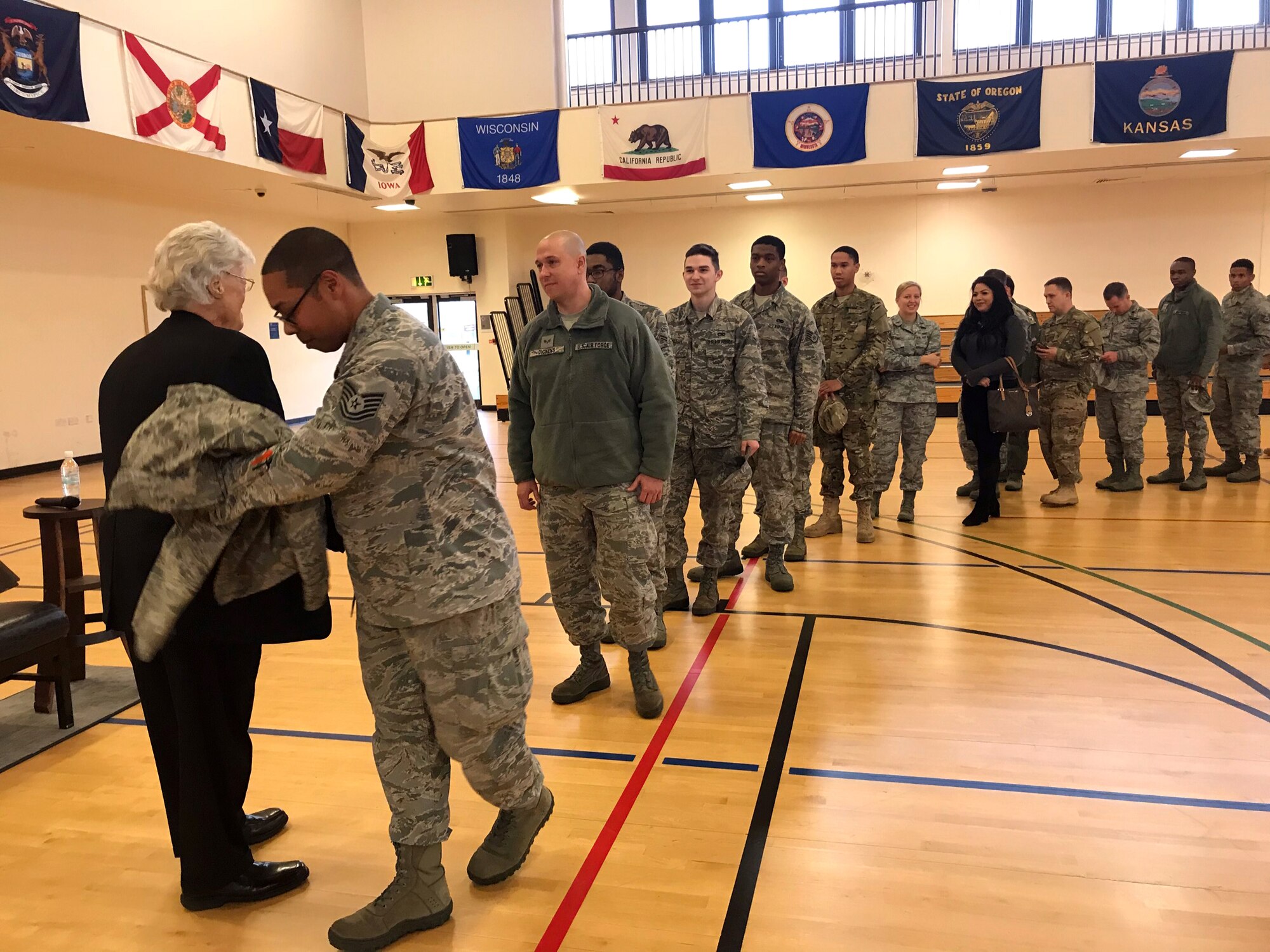 Team Mildenhall Airmen wait to greet Dave Roever, Vietnam War veteran and Purple Heart recipient, during a visit at RAF Mildenhall, England, Nov. 7, 2018. Roever presented a message of integrated resiliency and suicide prevention to Team Mildenhall Airmen. (Courtesy photo/Lisa Velez)