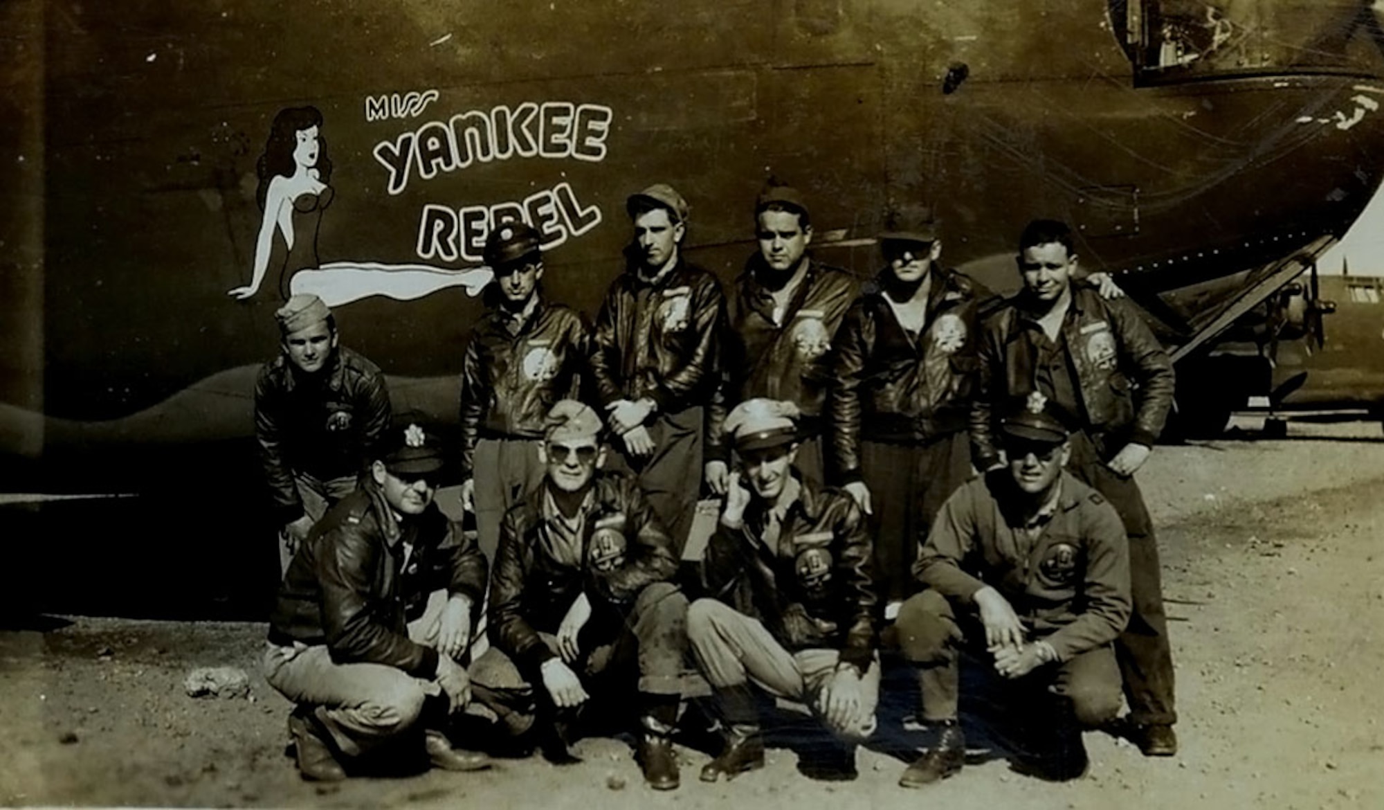 U.S. Army Air Corps 1st Lt. John D. Crouchley, kneeling, second right, and his crew pose for a photo by their B-24 Liberator, “Miss Yankee Rebel” in 1944. Crouchley was assigned to the 828th Bombardment Squadron, 485th Bombardment Group, Foggia, Italy, and went into combat in May 1944. Just one month later, he paid the ultimate sacrifice for his country when his aircraft was shot down over Bulgaria when he and his crew were returning from a bombing mission over Romania June 28, 1944. (Courtesy photo)