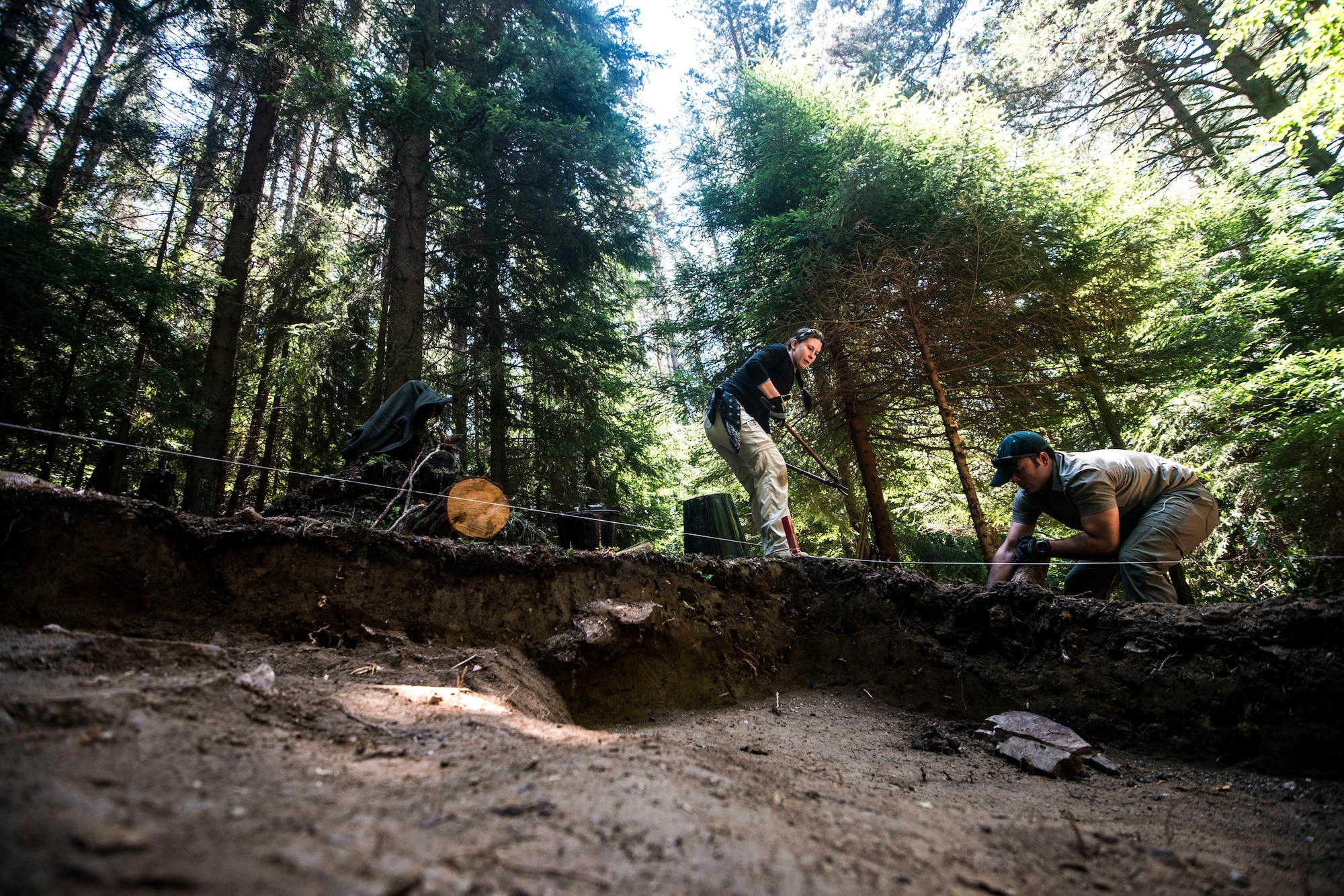 Kristen Baker, Scientific Recovery Expert (SRE), and U.S. Air Force Capt. Matthew Byrne, complete digging operations as part of the Defense POW/MIA Accounting Agency’s (DPAA) mission to Rodopi, Bulgaria, July 20, 2017. The team conducted 69 days of excavation operations in search of World War ll pilot 1st Lt. John D. Crouchley, who went down with his B-24 Liberator, the “Miss Yankee Rebel” 73 years ago. DPAA’s mission is to provide the fullest possible accounting for our missing personnel to their families and the nation. (U.S. Air Force photo by Staff Sgt. Leah Ferrante)