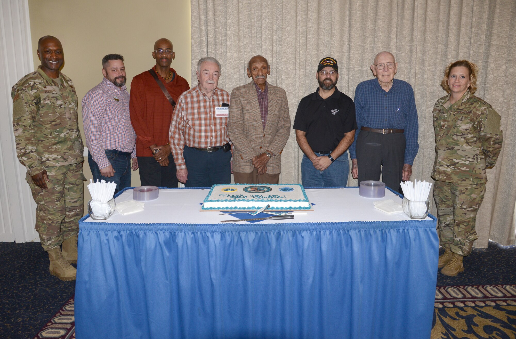 In honor of Retiree Appreciation Day, 72nd Air Base Wing Commander Col. Kenyon Bell, left, and 72ABW Command Chief Chief Master Sgt. Melissa Erb, right, joined the newest and oldest veteran retirees to cut the ceremonial cake. From left, Bell, Jason Crosby, Jon Tucker, Charlie Chittum, Herbert Bailey, Andy Mathias, Glenn Brooks and Erb.