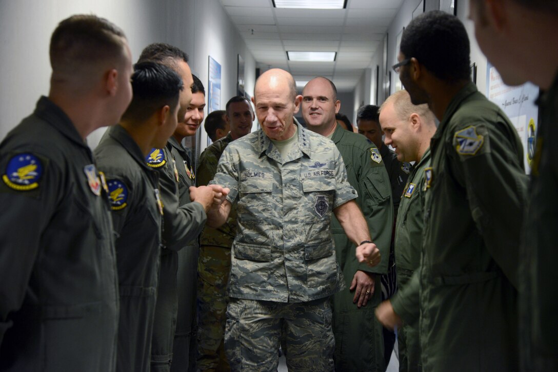 Gen. Mike Holmes, commander Air Combat Command, gave high-fives and fist-bumps to the members of the 965th Airborne Air Control Squadron as they lined their hallways for his visit Nov. 1. Holmes visited the 552nd Air Control Wing's operational and maintenance groups to gain a better perspective of flying unit operations, working environments and maintenance capabilities.