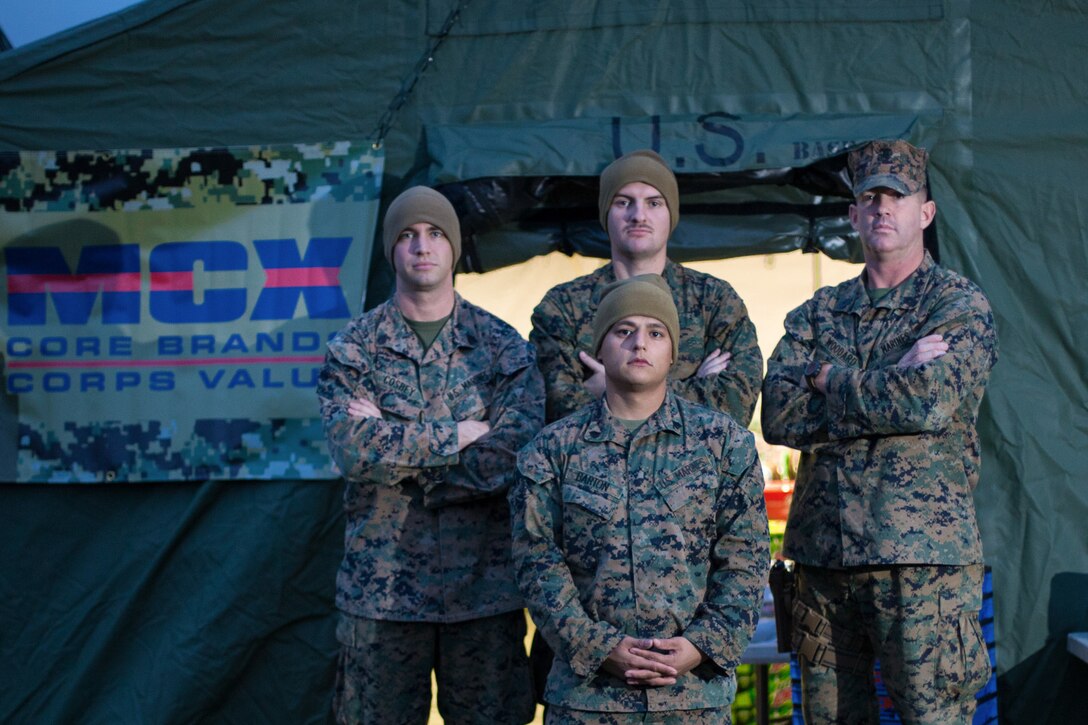 U.S. Marines with Combat Logistics Battalion 2, 2nd Marine Logistics Group-Forward, pose for a photo in front of a mobile Marine Corps Exchange in Voll, Norway, Oct. 21, 2018. The Marines provided basic hygiene and comfort products to personnel before the start of the main exercise during Trident Juncture 18. Trident Juncture 18 enhances the U.S. and NATO Allies’ and partners’ abilities to work together collectively to conduct military operations under challenging conditions. (U.S. Marine Corps photo by Sgt. Bethanie C. Sahms)